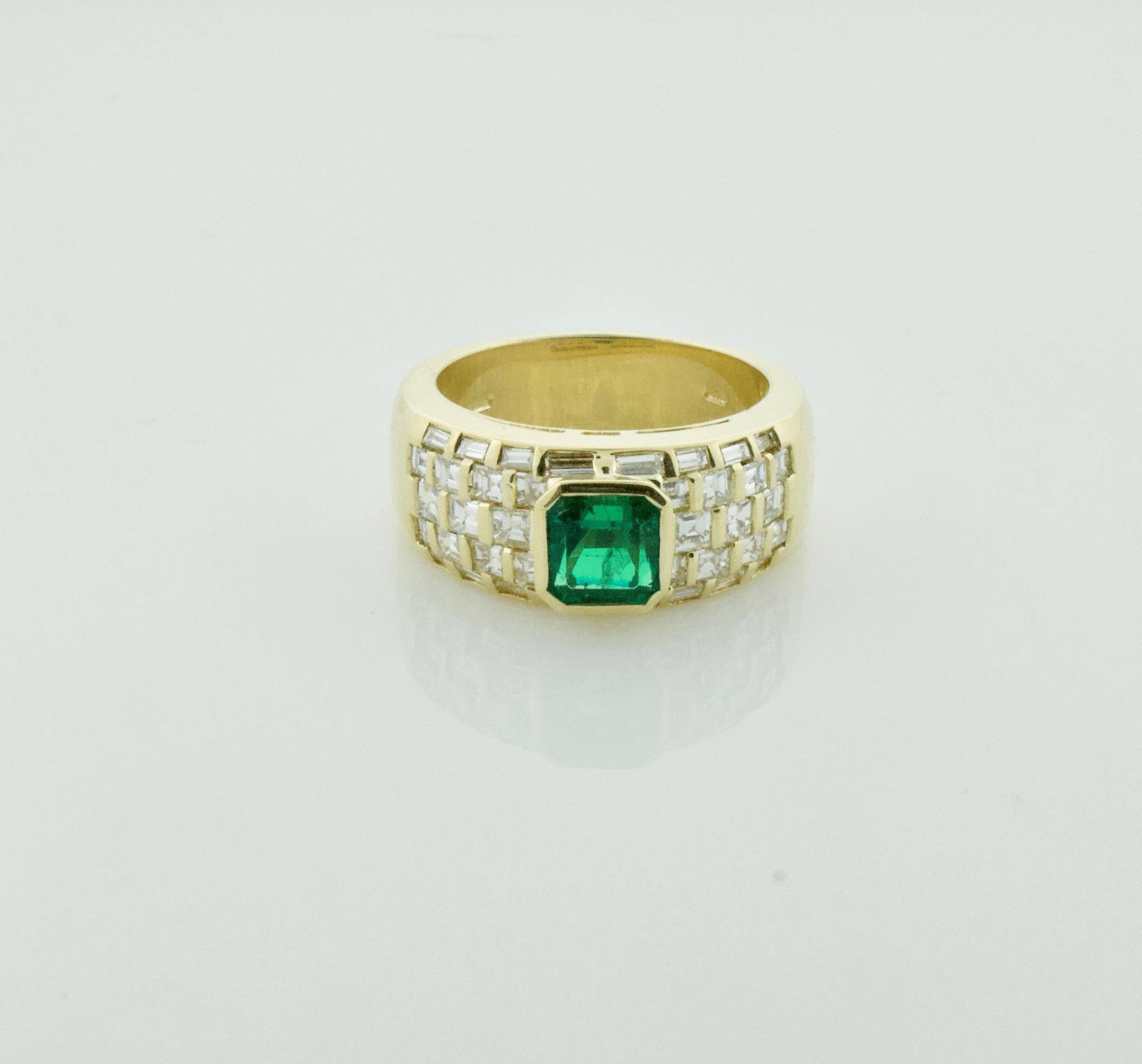 Vibrant Emerald and Diamond Ring in 18k Yellow Gold
One Square Cut Emerald Weighing 1.15 Carats Approximately [bright with no imperfections visible to the naked eye]
Thirty Eight  Baguette and Square Cut Diamonds Weighing 1.00 Carats Approximately