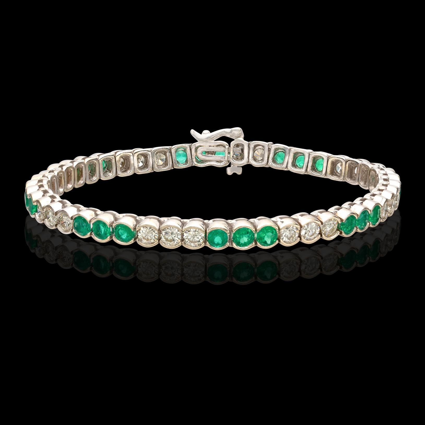 For the lover of brilliant green! The 18k white gold tennis bracelet is designed with 24 semi-bezel-set round emeralds of lively green color, weighing together 4.00 carats, alternating with 23 round  brilliant-cut diamonds, H-I/VS-SI, weighing in