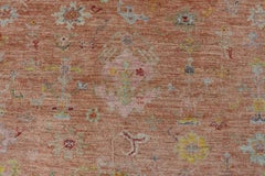 Vibrant Floral Medley on Salmon Pink Hand-Knotted Rug by Keivan Woven Arts