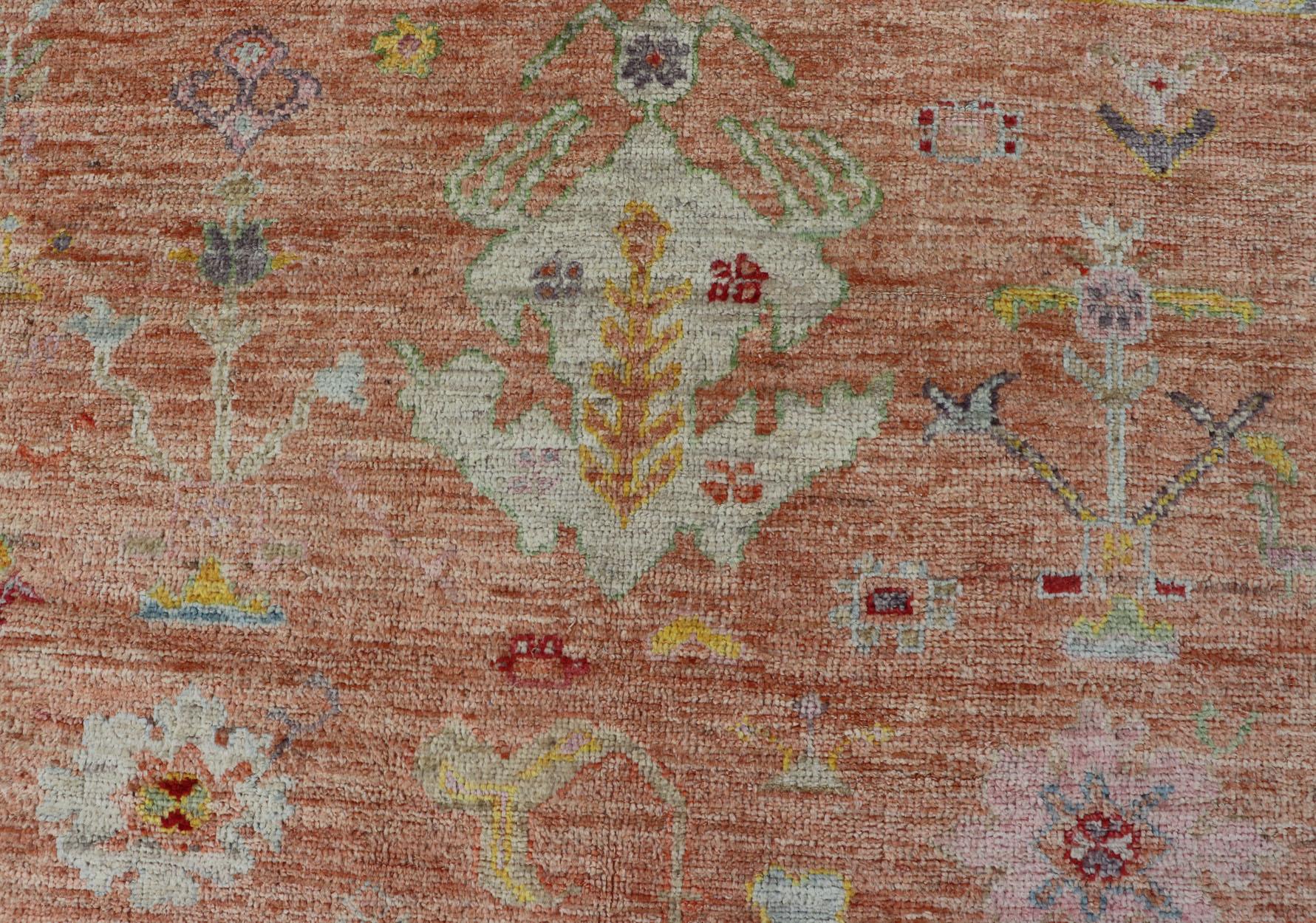 Oushak Vibrant Floral Medley on Salmon Pink Hand-Knotted Rug by Keivan Woven Arts  For Sale