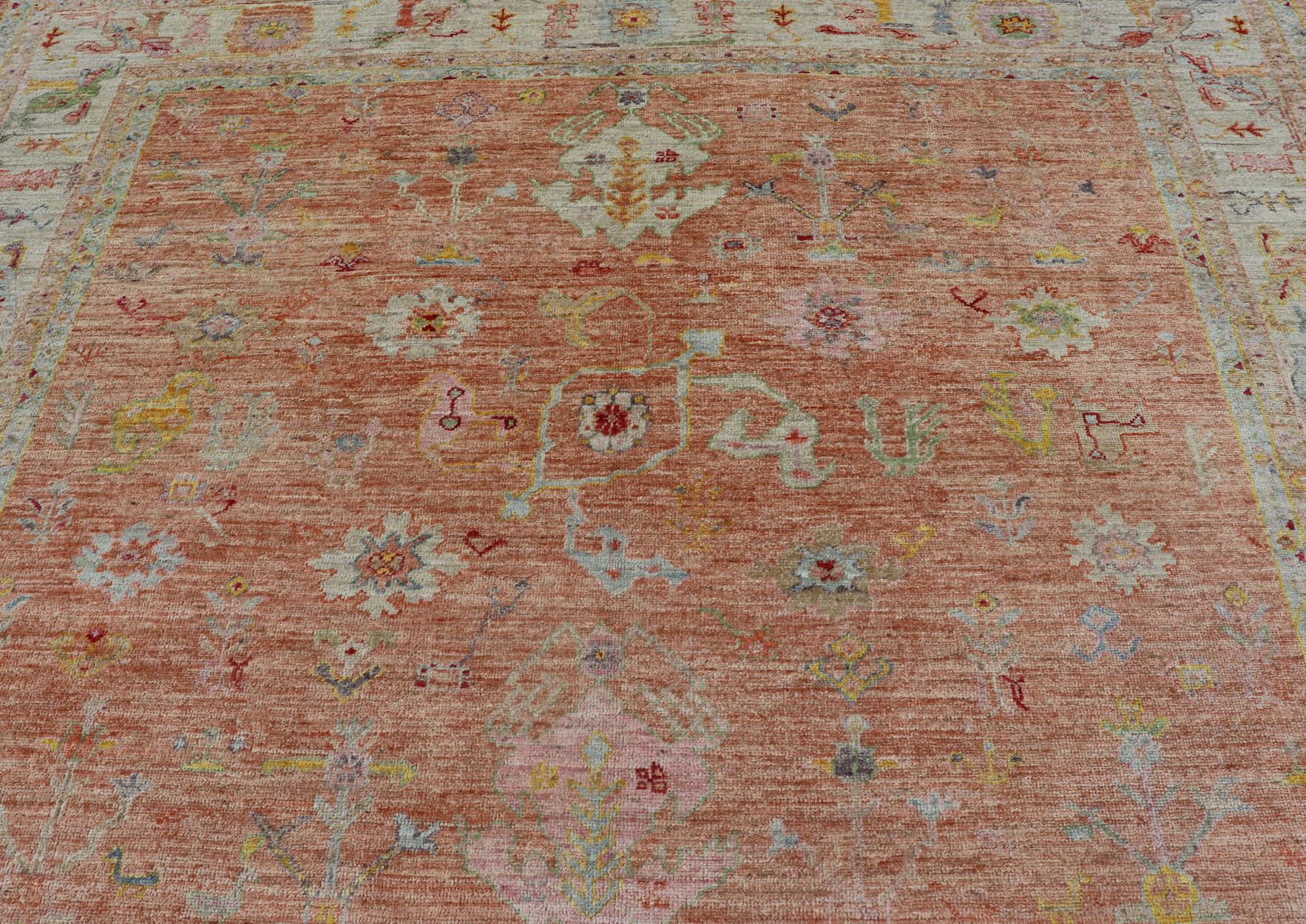 Wool Vibrant Floral Medley on Salmon Pink Hand-Knotted Rug by Keivan Woven Arts  For Sale