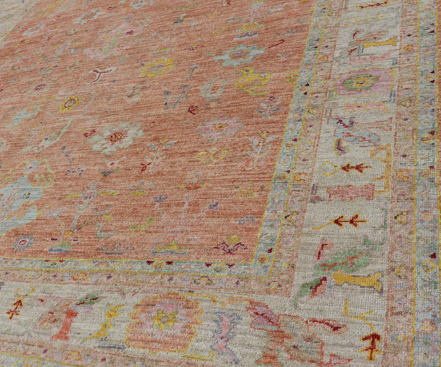 Vibrant Floral Medley on Salmon Pink Hand-Knotted Rug by Keivan Woven Arts  1