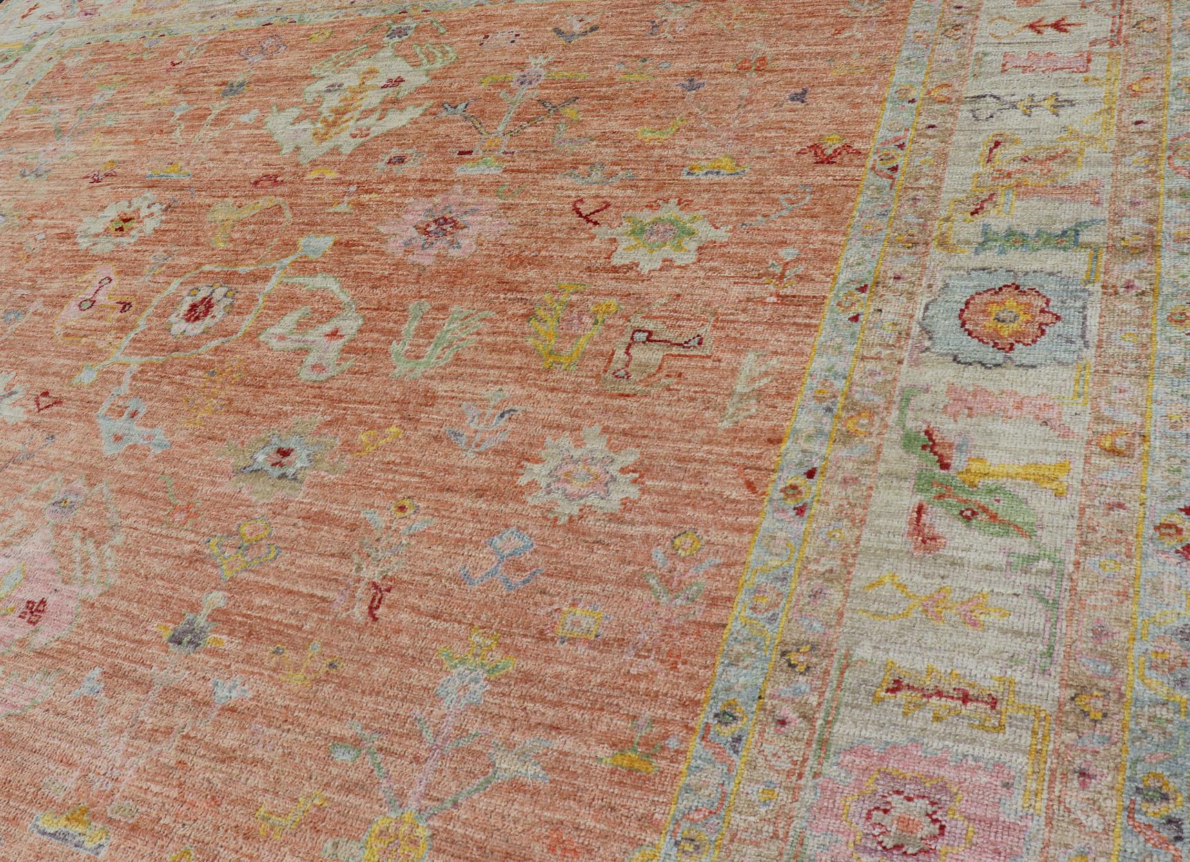 Vibrant Floral Medley on Salmon Pink Hand-Knotted Rug by Keivan Woven Arts  2