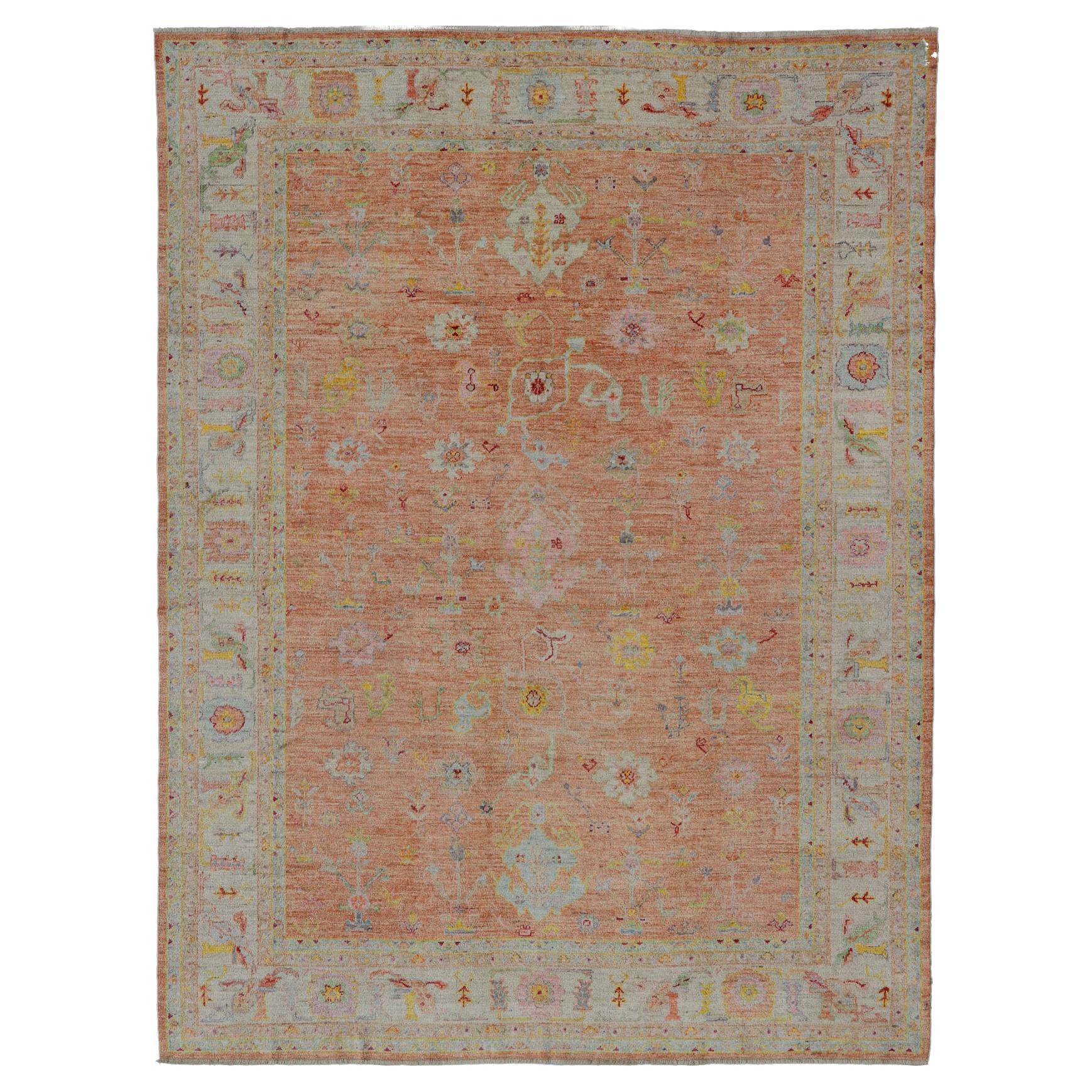 Vibrant Floral Medley on Salmon Pink Hand-Knotted Rug by Keivan Woven Arts  For Sale