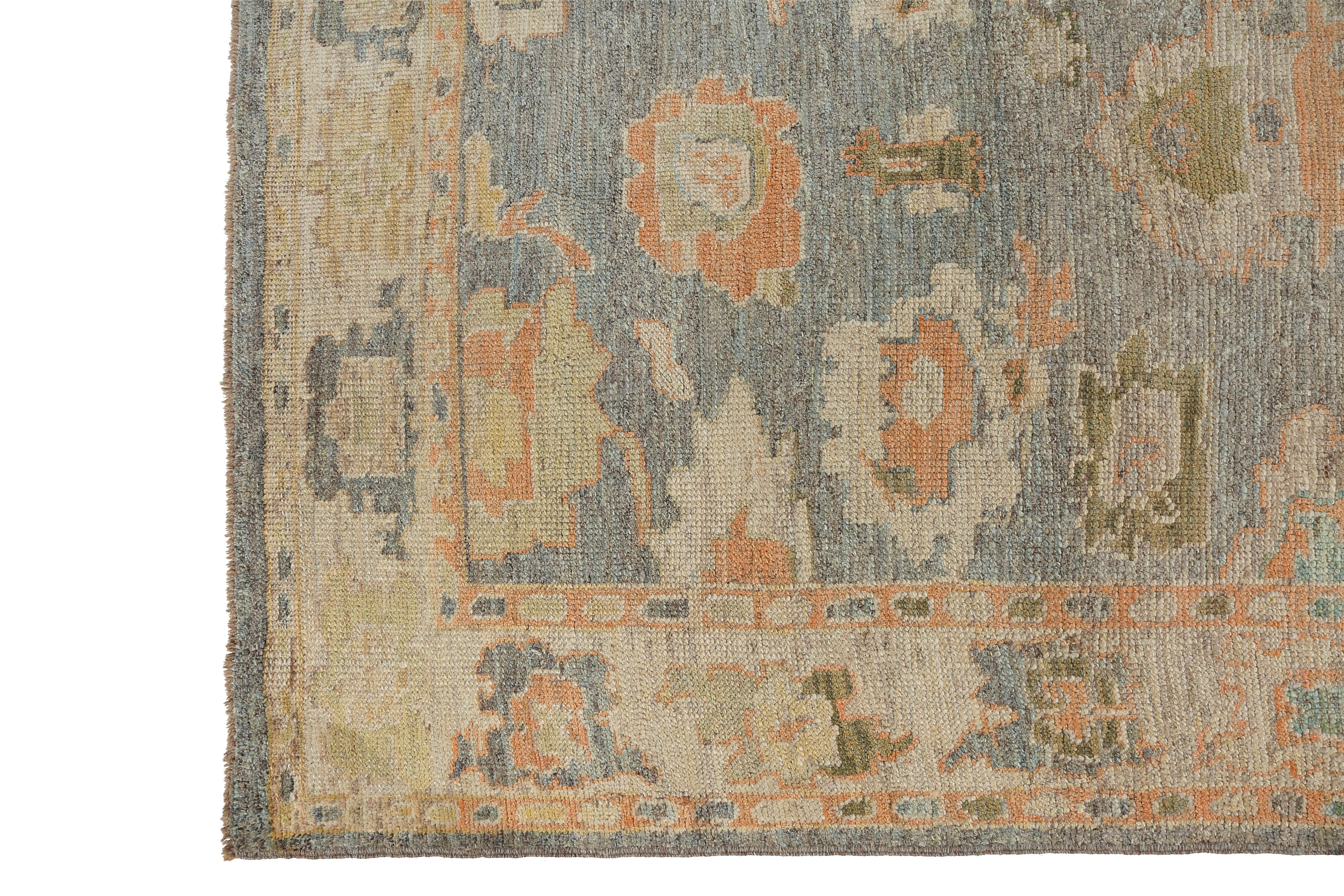 Introducing our handmade Turkish Oushak rug, measuring 5'0'' x 7'2''. This exquisite piece features a stunning grey background with delicate pastel color tones in coral orange, yellow, and green. The intricate design showcases the skilled