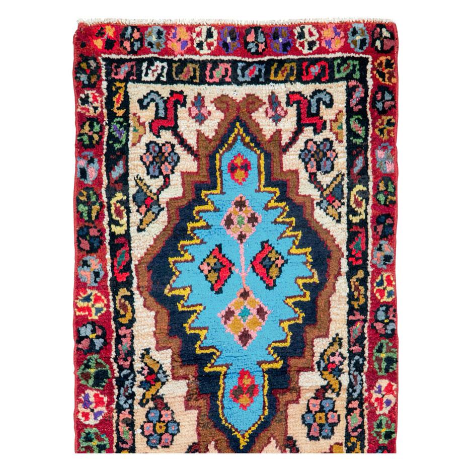 A vintage Persian Hamadan throw rug handmade during the mid-20th century with vibrant cotton highlights.

Measures: 1' 10