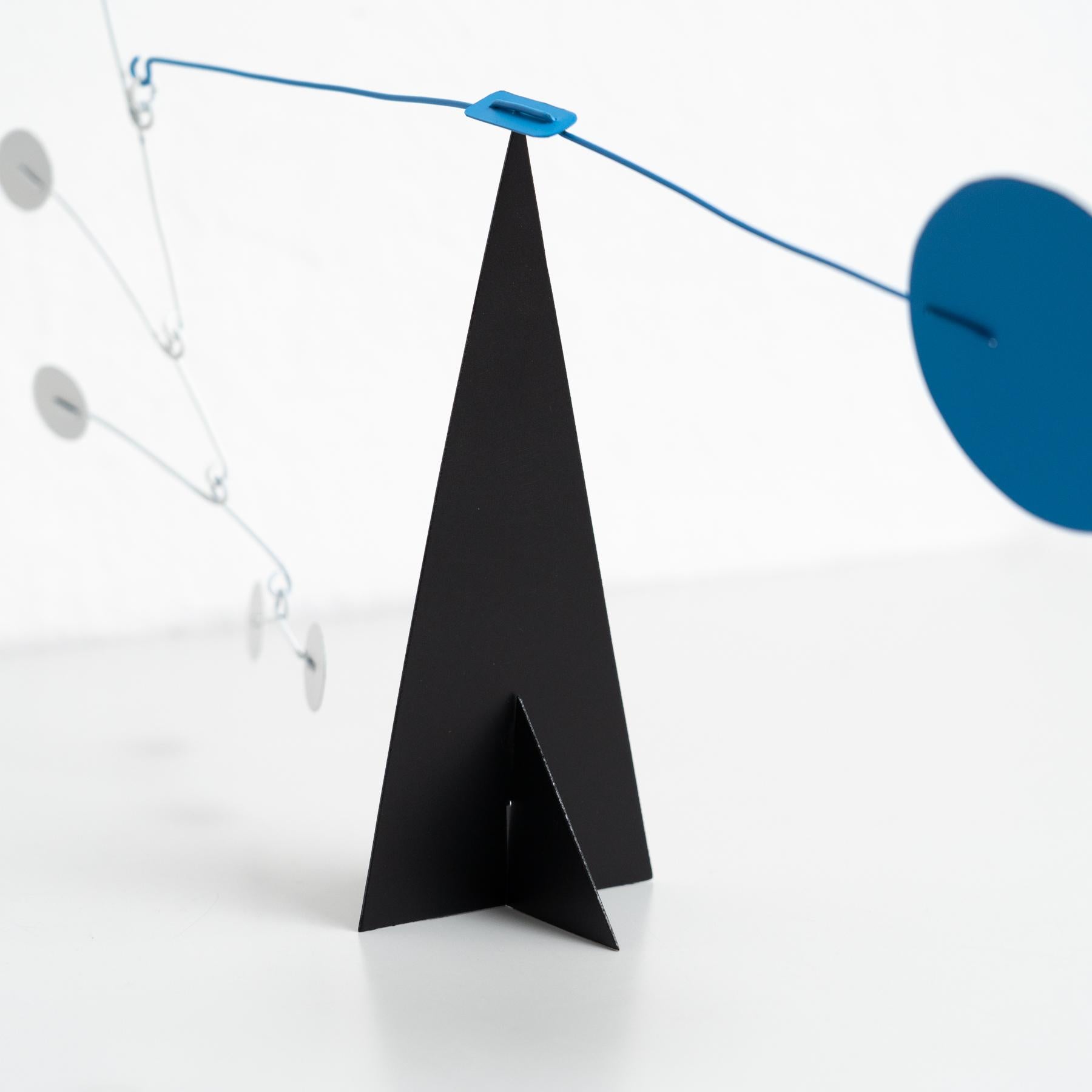 Vibrant Motion: Kinetic Sculpture - Iron, Paint, Movement 1
