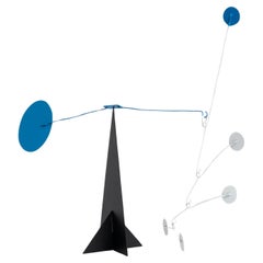 Vibrant Motion: Kinetic Sculpture - Iron, Paint, Movement