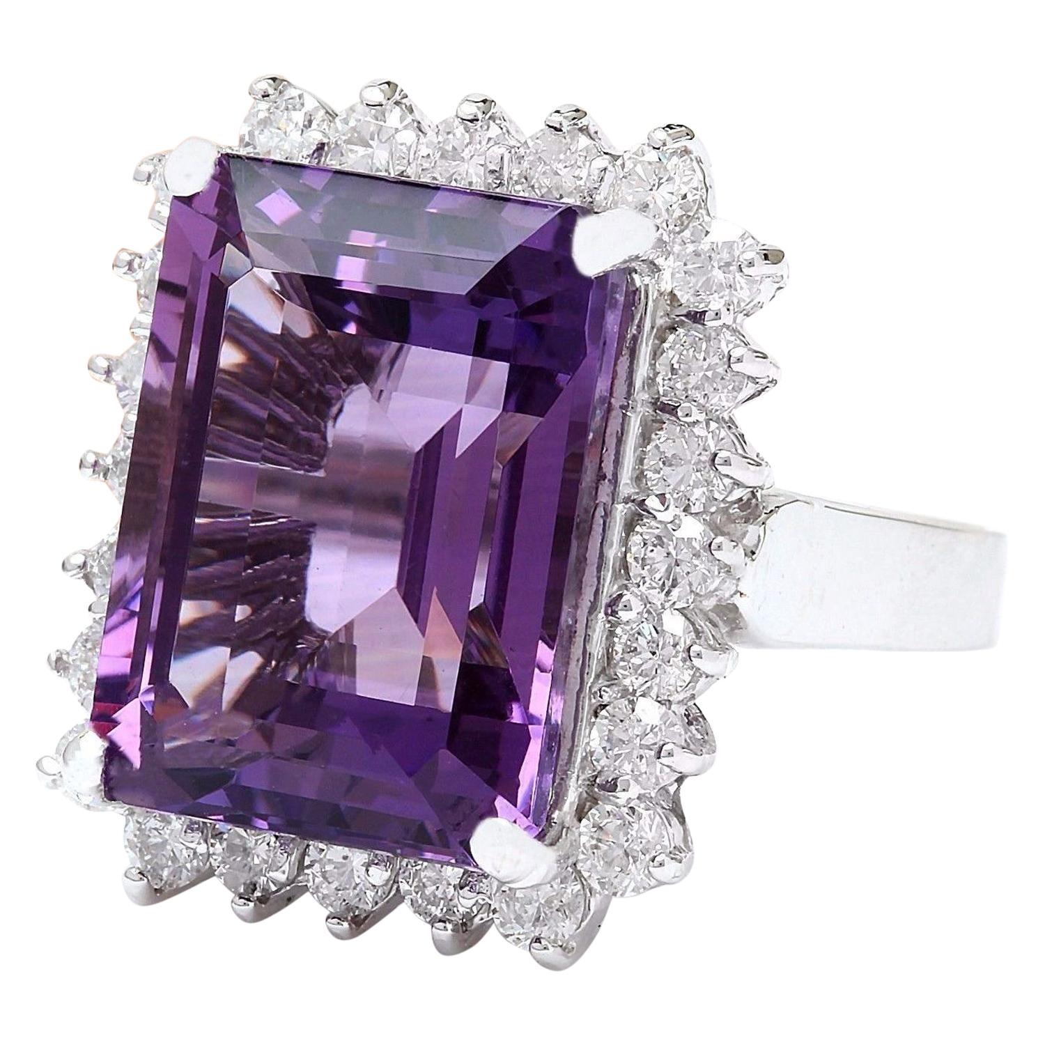 Presenting our exquisite 9.20 Carat Natural Amethyst 14K Solid White Gold Diamond Ring:
Crafted from luxurious 14K White Gold, this stunning ring features a captivating 8.00 Carat Amethyst stone, cut in an elegant emerald shape and measuring