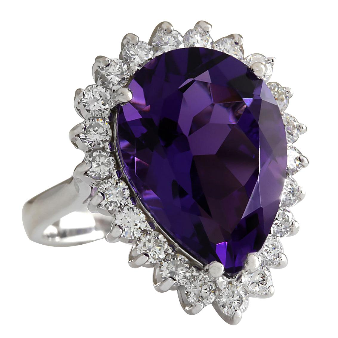 ndulge in the captivating allure of this exquisite 14K white gold diamond ring, showcasing a stunning 10.80 carat natural amethyst. The majestic amethyst, measuring 18.00x13.00 mm and weighing 9.54 carats, radiates a rich purple hue that captures
