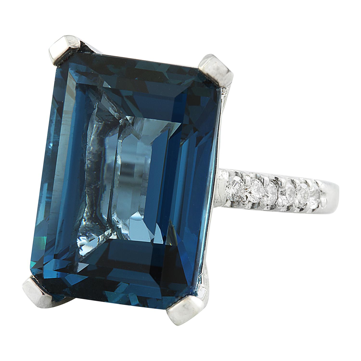 Introducing our breathtaking 20.80 Carat Natural Topaz 14 Karat White Gold Diamond Ring. Stamped with 14K authenticity, this ring weighs 8.5 grams in total. The exquisite topaz gemstone weighs 20.48 carats, measuring 18.00x13.00 millimeters, and has