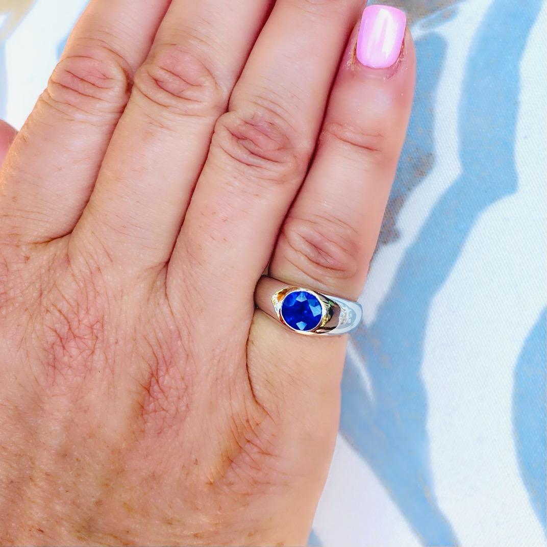 For the lover of all things blue! This unique platinum ring features a rich, vibrant blue oval sapphire weighing 1.20 carats, perfectly set in a significant platinum ring. The sapphire has lovely light return and evenness of color saturation, and