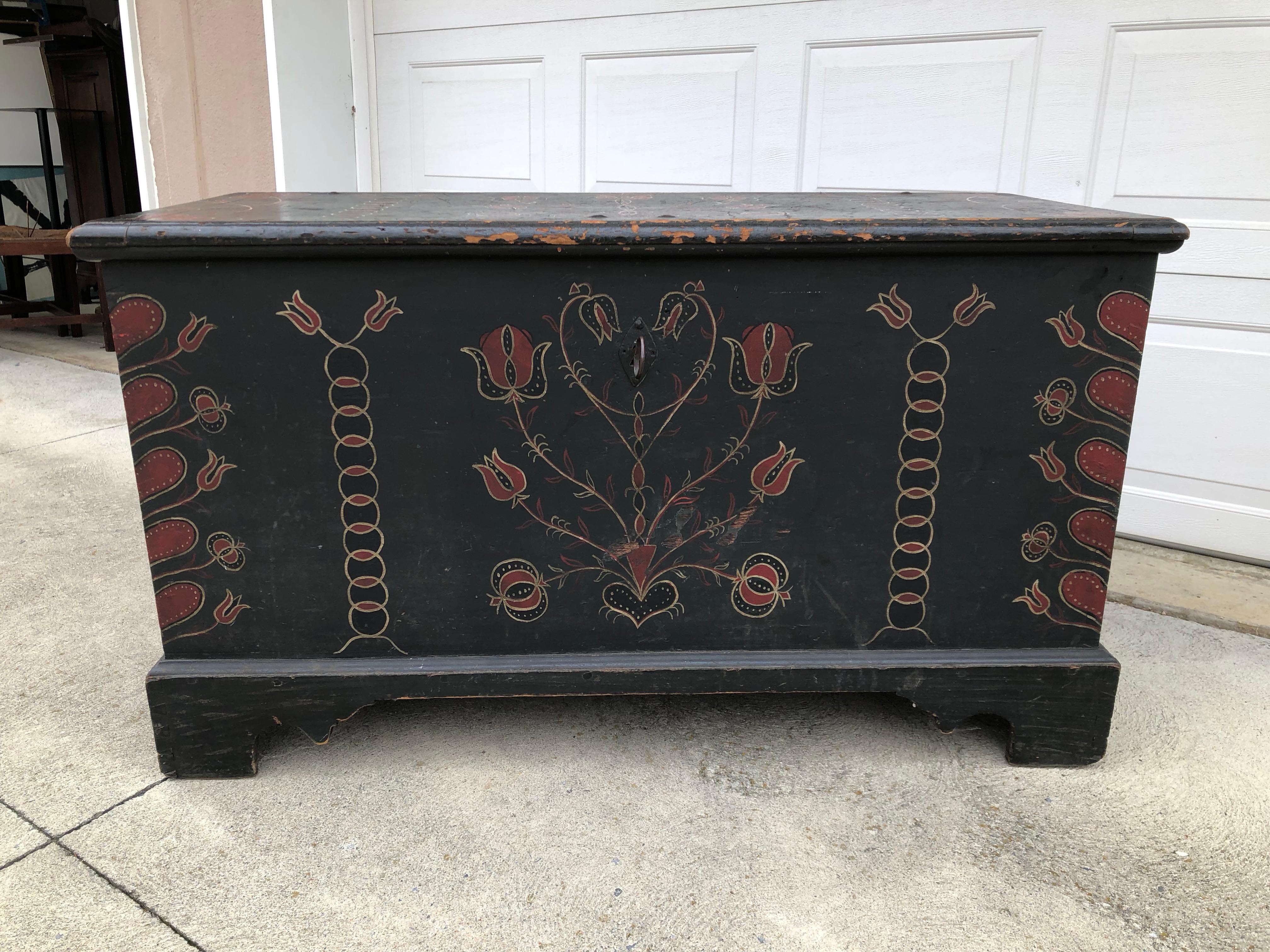 Painted blanket chest with folky decorations, American, likely Lehigh County, circa 1780. A painted poplar blanket chest having large flowers in pots and whimsical decoration. Original paint, similar example in the Philadelphia Art Museum.
 