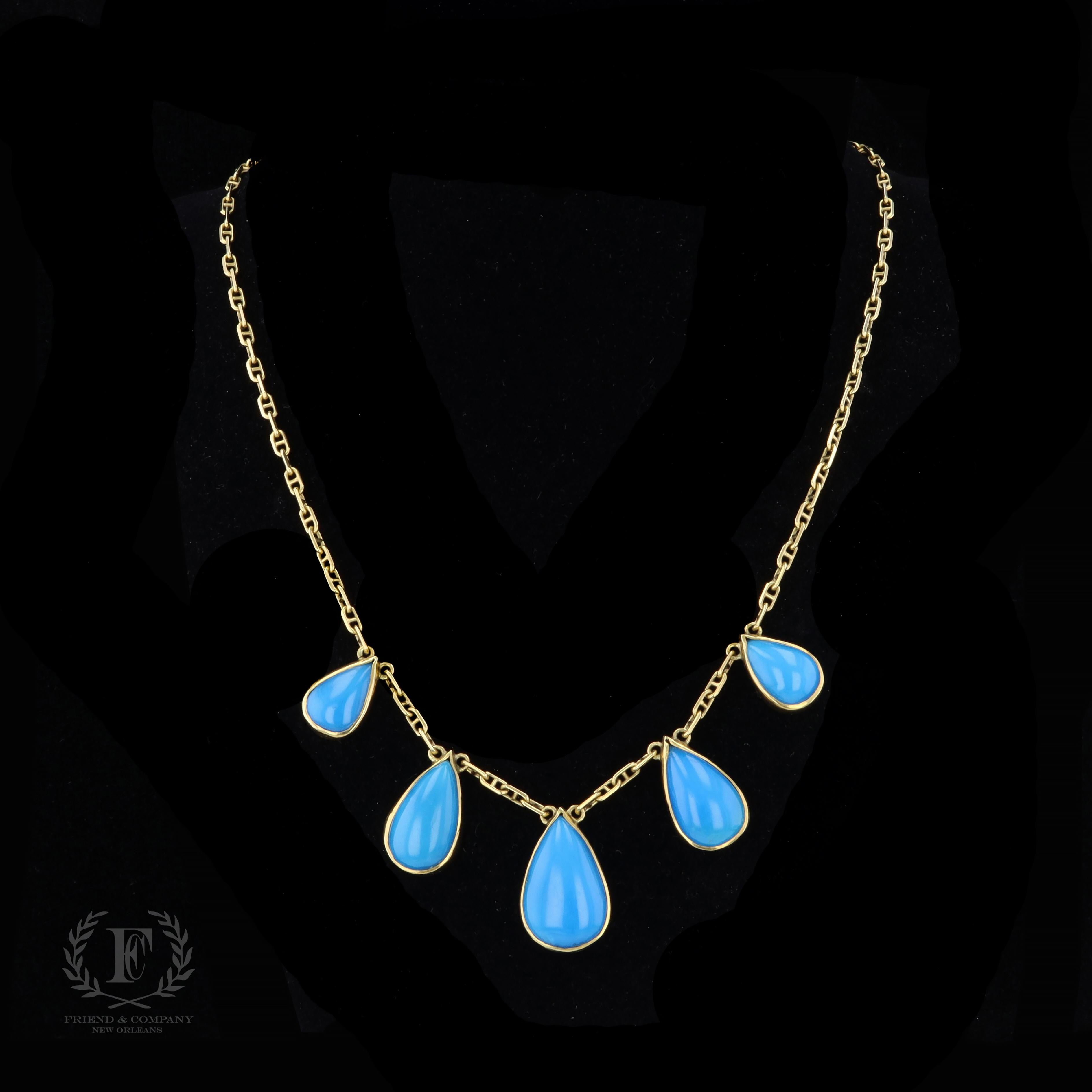 An extraordinary statement necklace that is perfect for all of your spring and summer soirées. The necklace is set with five pear cabochon cut turquoise stones. The necklace measures 20 inches in length and weighs 28.3 grams.