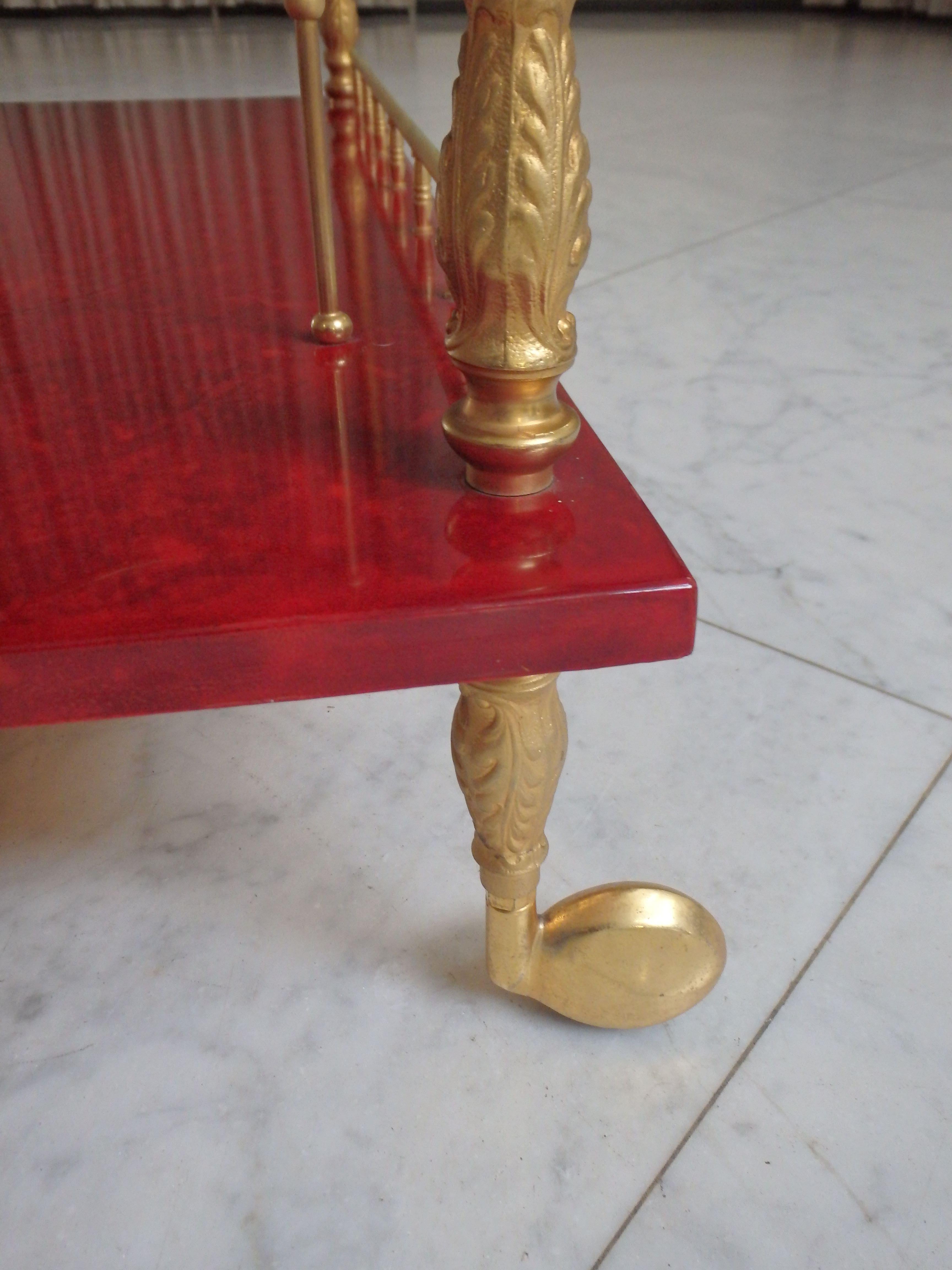 Mid-Century Modern vibrant red coat skin bar cart by ALDO TURA with wings to be opend For Sale