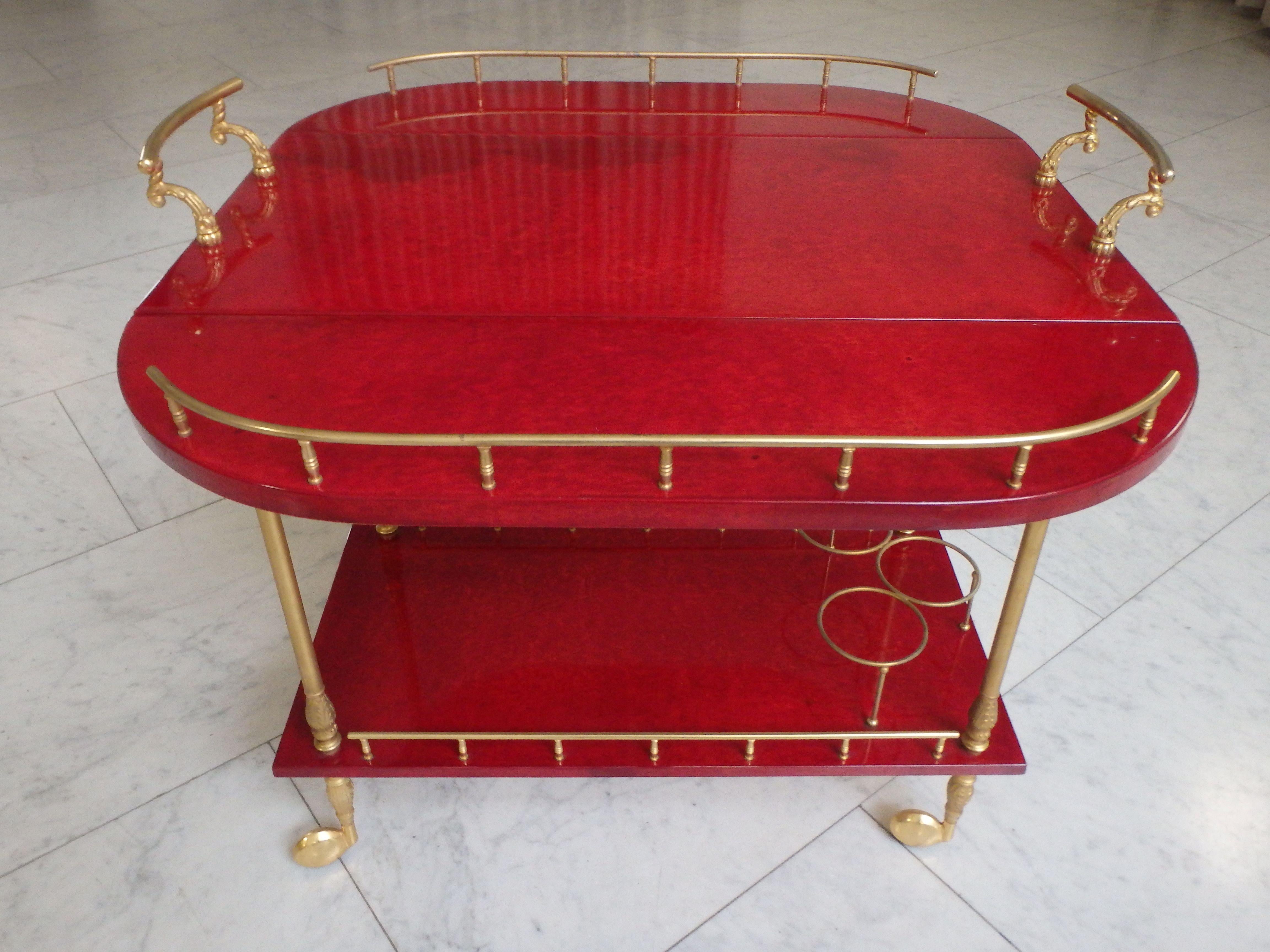Italian vibrant red coat skin bar cart by ALDO TURA with wings to be opend For Sale