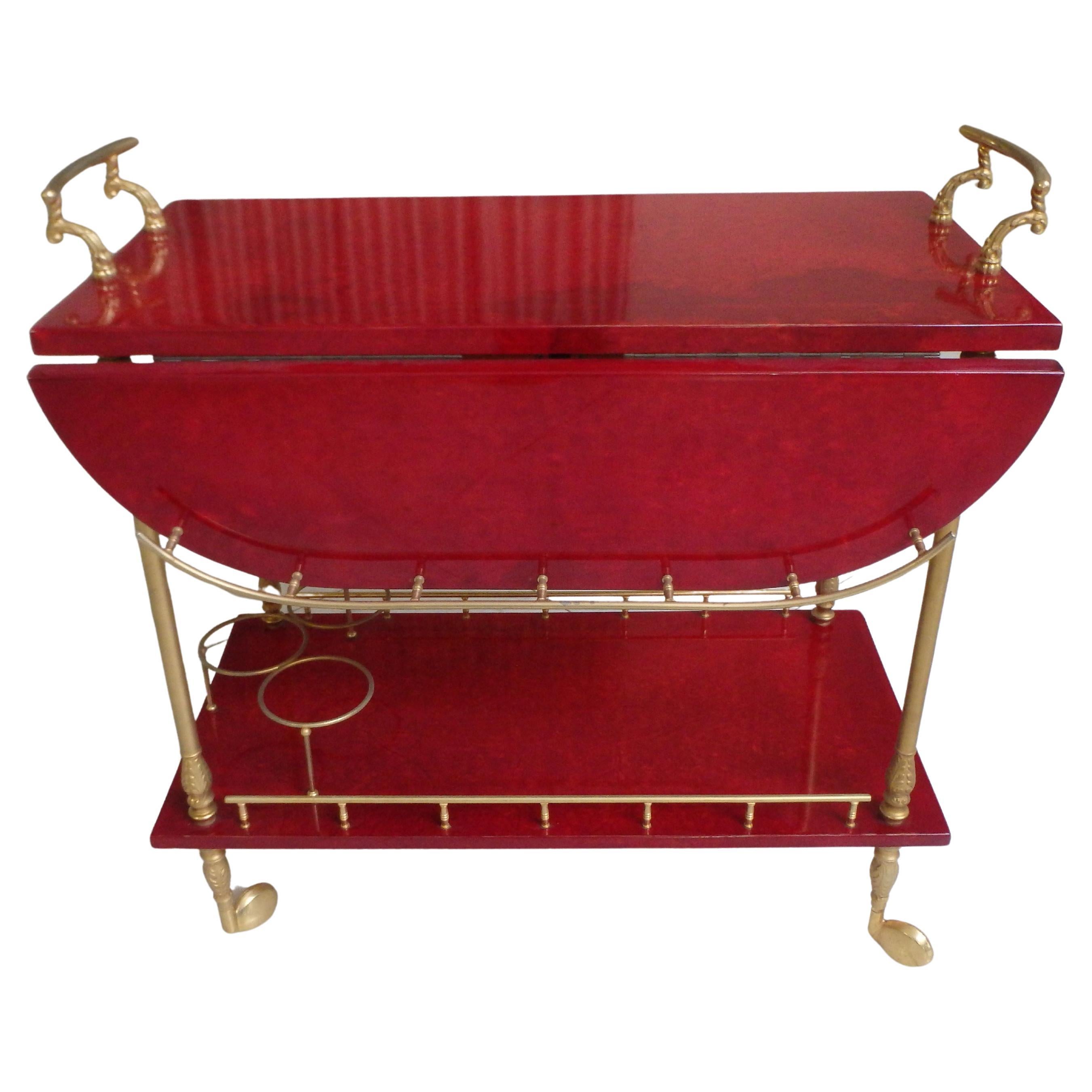 vibrant red coat skin bar cart by ALDO TURA with wings to be opend For Sale