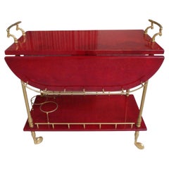 vibrant red coat skin bar cart by ALDO TURA with wings to be opend