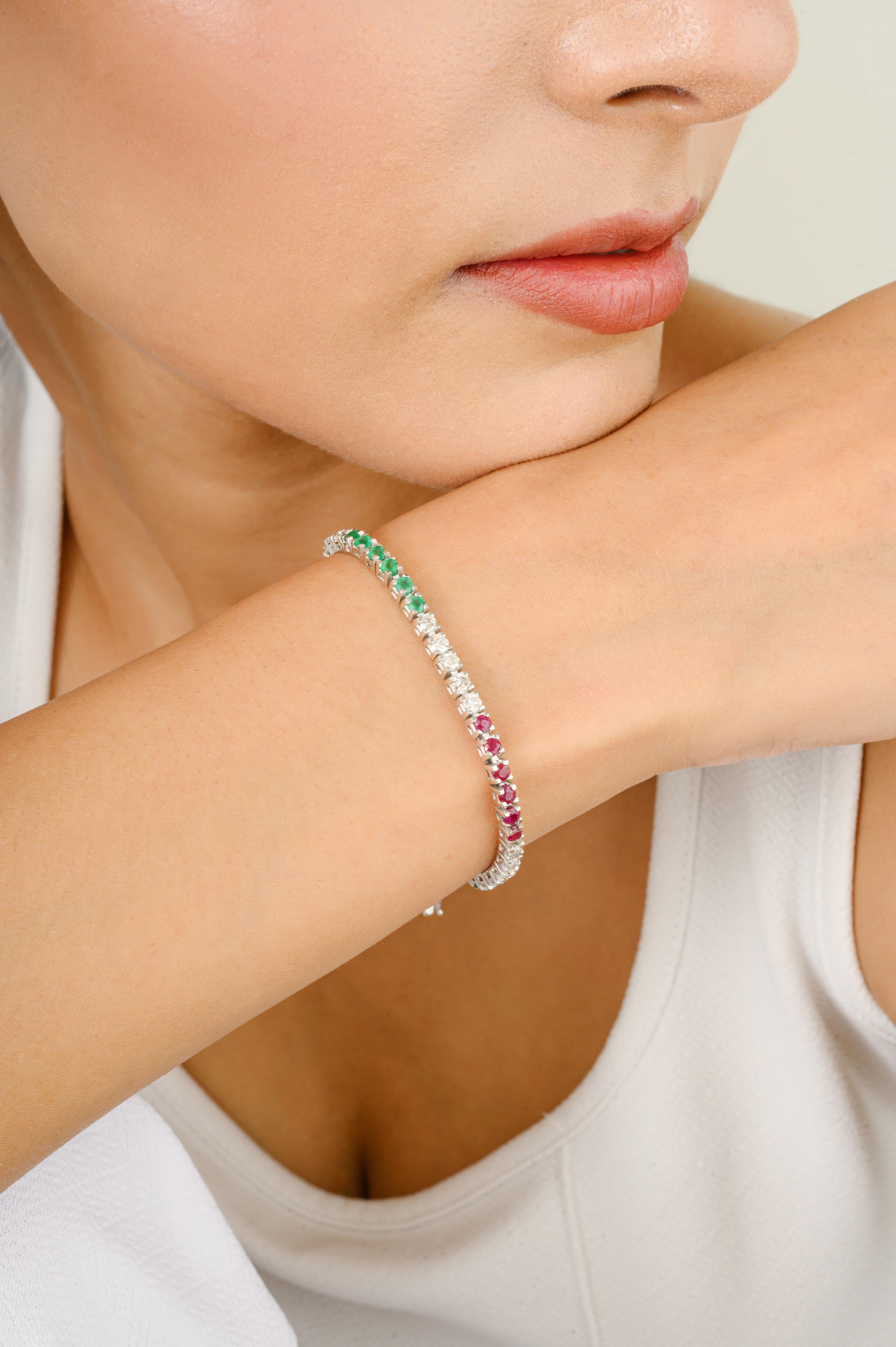 This Vibrant Rubies Emeralds Diamonds Sleek Tennis Bracelet for Gift in 18K gold showcases endlessly sparkling natural ruby, weighing 2.2 carats and diamonds of 1.62 carats. It measures 7 inches long in length. 
Ruby improves mental strength and