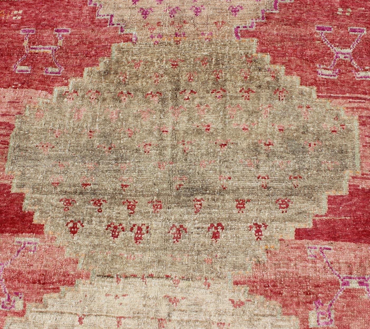Mid-20th Century Vibrant Turkish Vintage Runner in Faded Red, Coral, Orange, Pink and Green For Sale