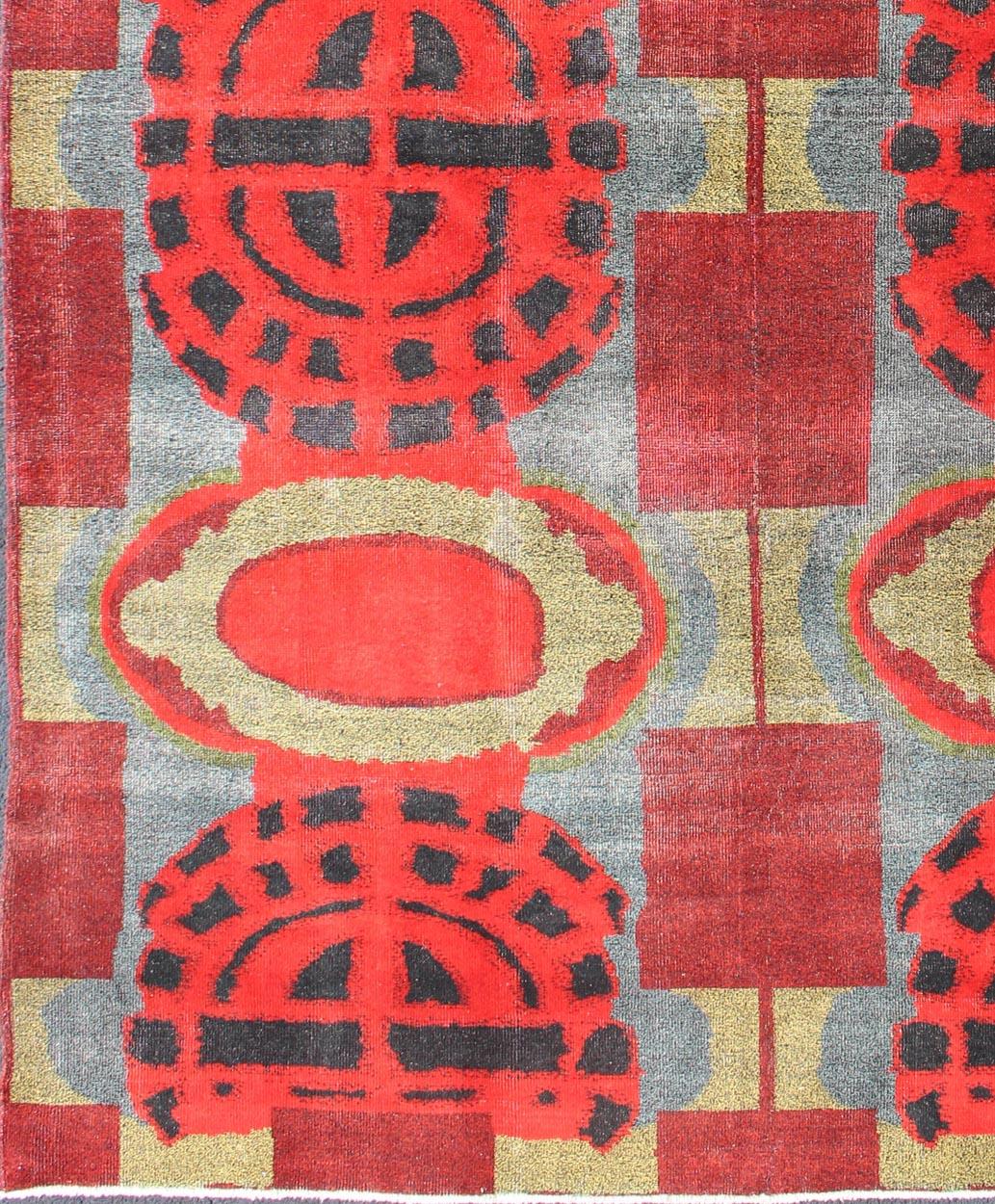 Graphic red-toned geometric design modern vintage Turkish rug, rug en-123914, country of origin or type: Turkey or Oushak, circa 1950.

This modern-design vintage Turkish Oushak rug features a bold and colorful red geometric design set atop a