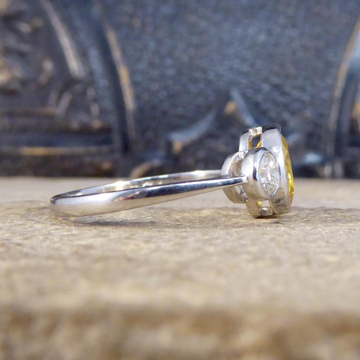 Edwardian Vibrant Yellow Sapphire and Diamond Three Stone Ring in Platinum