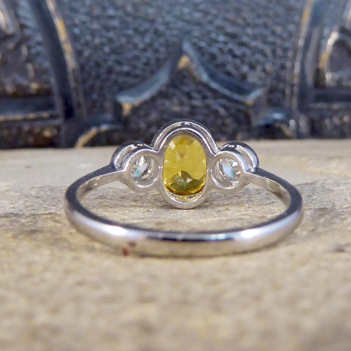 Oval Cut Vibrant Yellow Sapphire and Diamond Three Stone Ring in Platinum