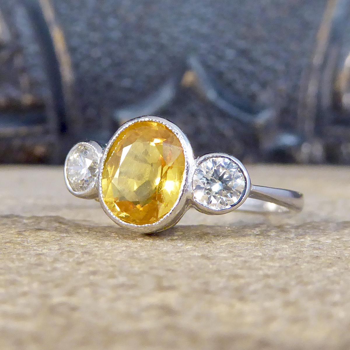 Vibrant Yellow Sapphire and Diamond Three Stone Ring in Platinum In Good Condition In Yorkshire, West Yorkshire
