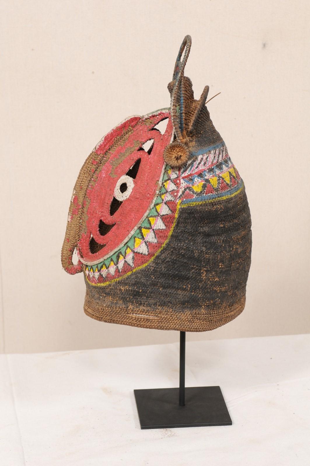 20th Century Vibrantly Colored Baba Festival Mask on Stand from Papua New Guinea