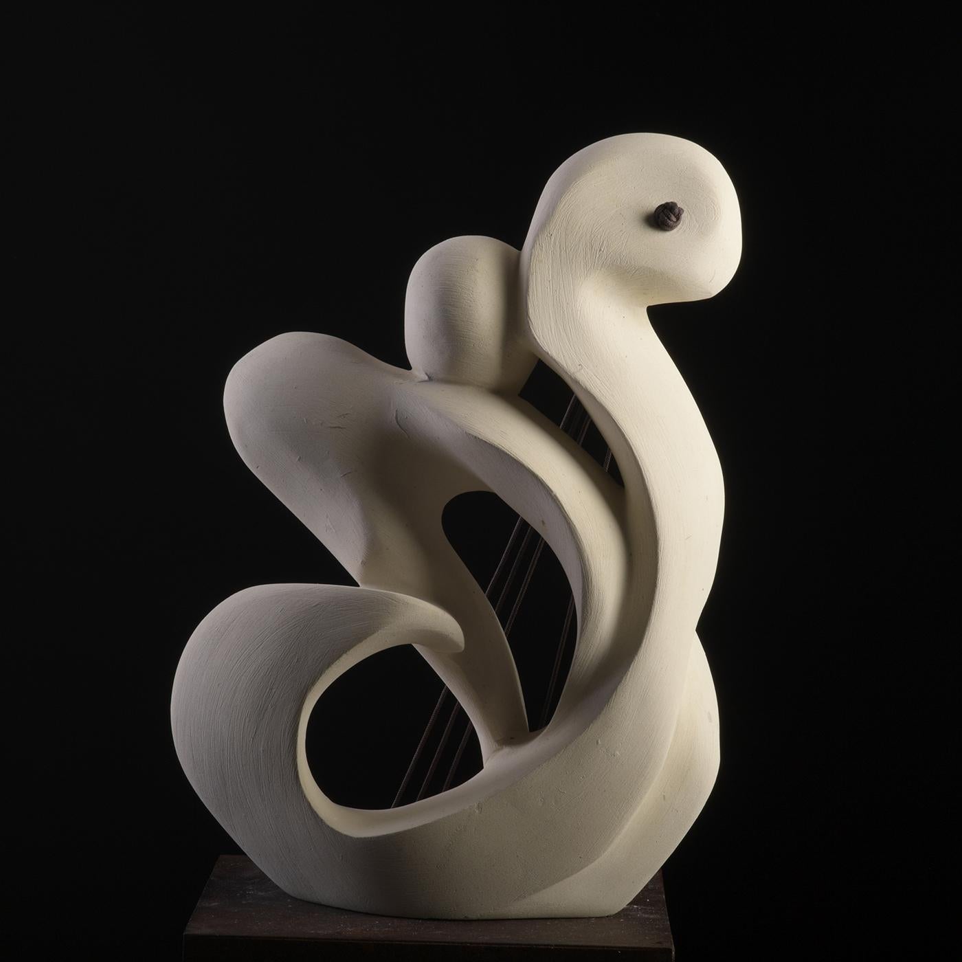 The sounds of butterflies' wings fluttering and their vibrant colors inspired this vaguely anthropomorphic sculpture made of a rare marine-origin stone - only quarried near Lecce, Apulia - rich in both animal and plant fossils. Minutely sculpted by