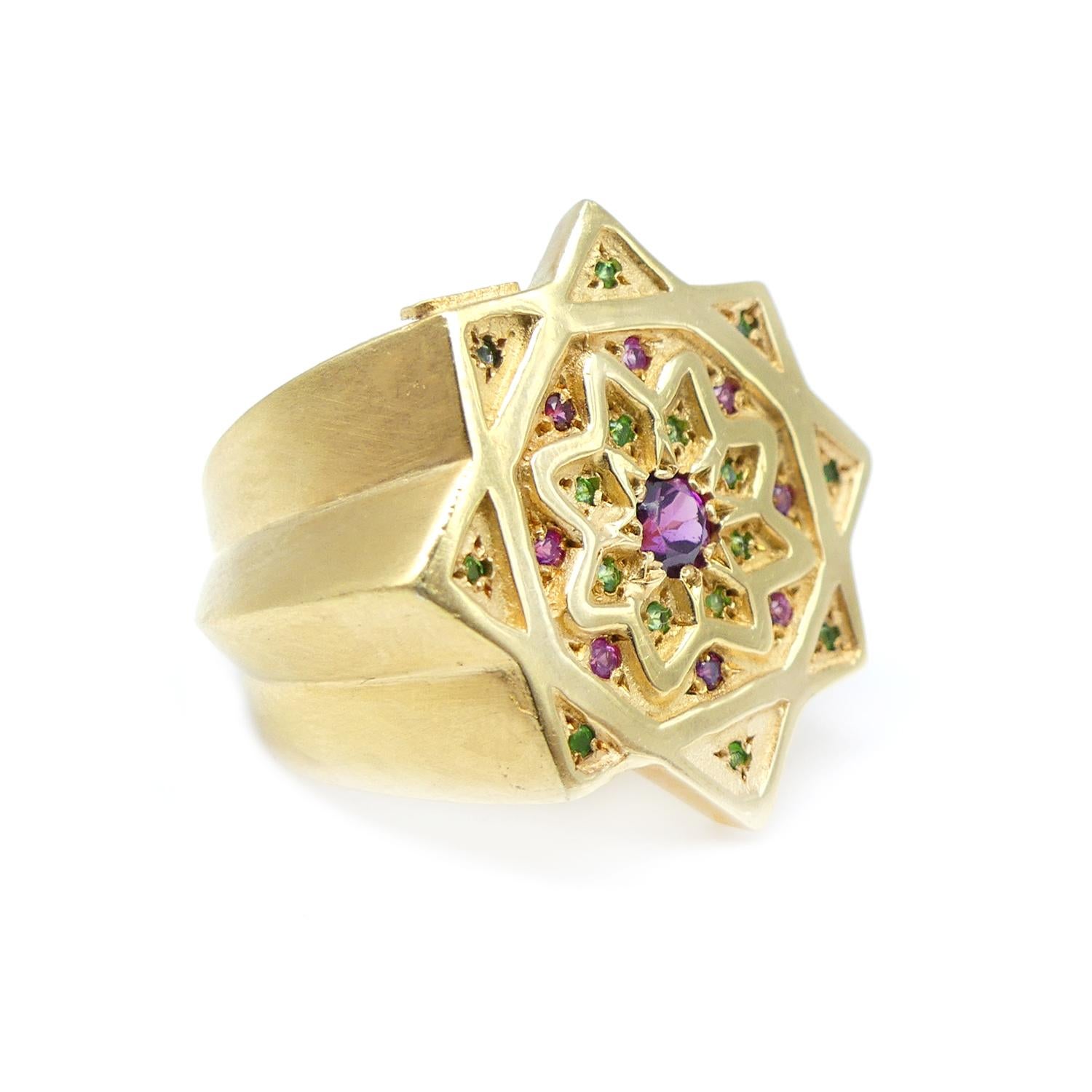 Vicente Gracia Amethyst Rubies Tsavorites Silver Gold Plated Ring

Ring in silver gold plated with central amethyst, rubies and tsavorites.

The eight pointed star represent the Fountain of Life that symbolizes the expansion of the soul. Inside, a