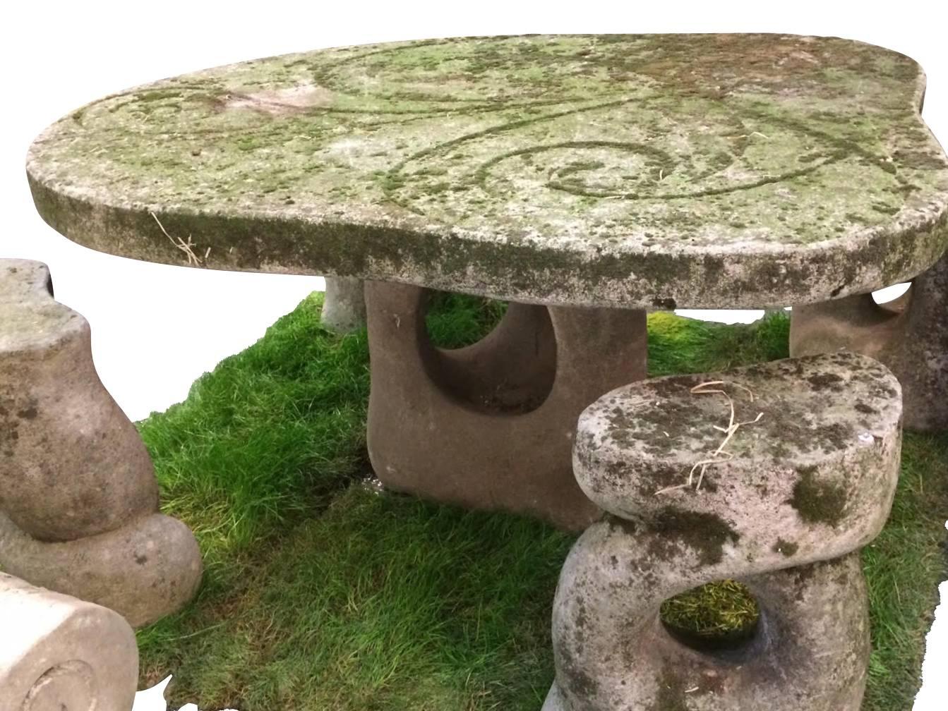 1940s Italian unusual design / shaped vicenza stone garden table with four whimsical stone garden stools.
Engraved decorative detail on top of table.
Natural patina with moss and lichen embedded in stone.
Table measures 44