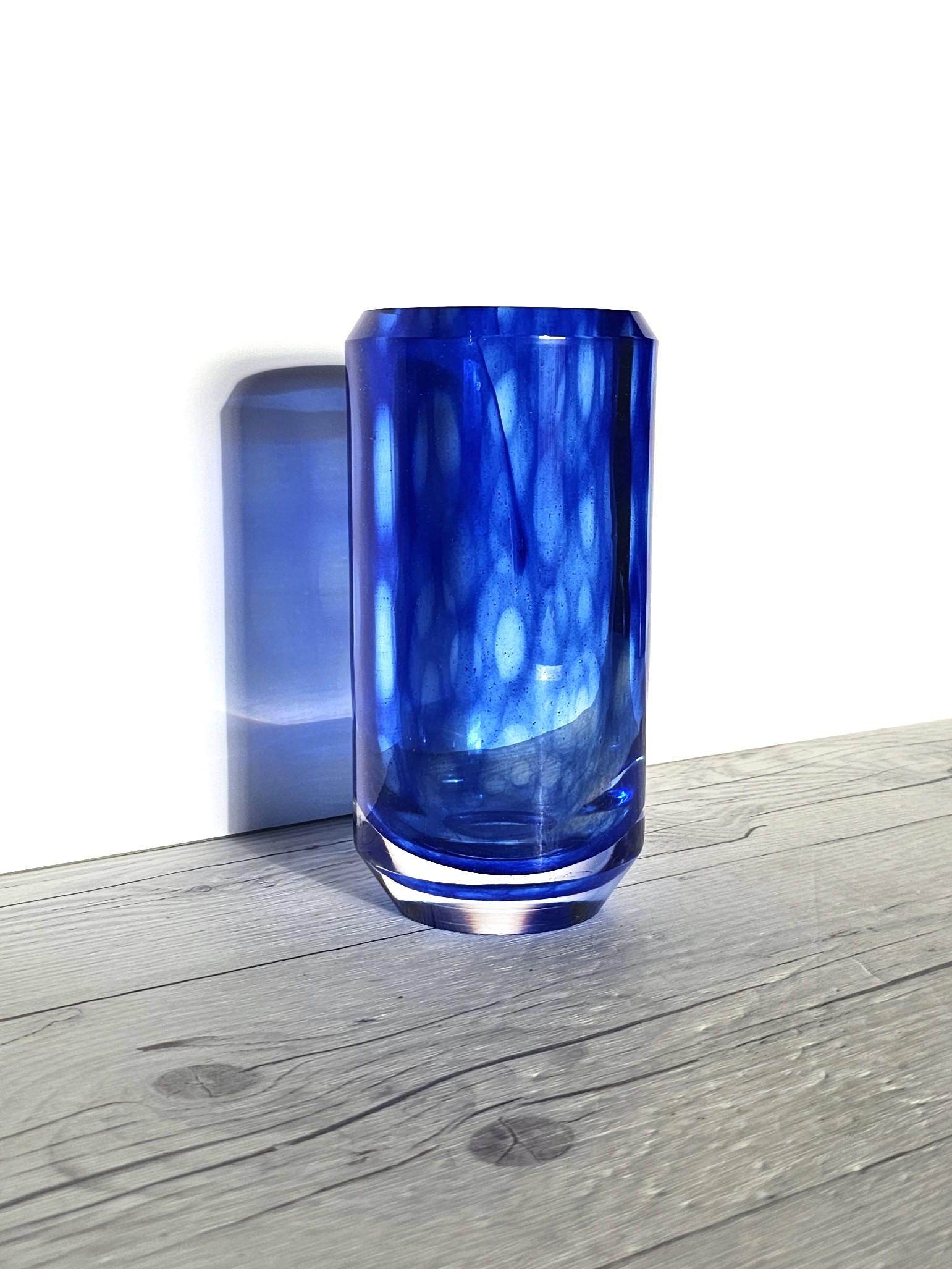 This sleek work of Scandinavian Modern art glass is by Vicke Lindstrand (b. 1904 - d. 1983). Lindstrand is considered one of the most influential 20th-century glass artists and a glass art pioneer. His prolific career held many design highlights,