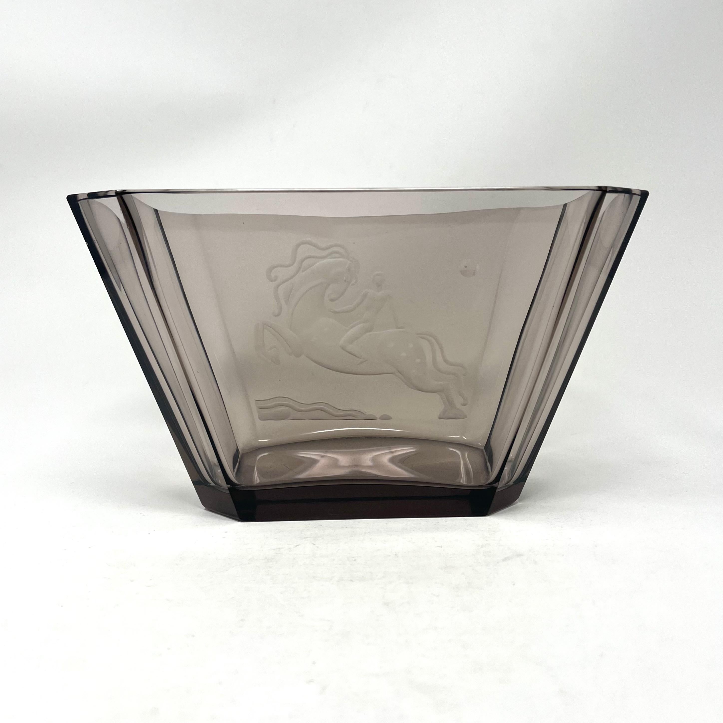 Vicke Lindstrand engraved smoky coloured glass bowl with Art-Deco style horse and rider and moon. For Orrefors, Sweden c1930s. Signature to base: Orrefors L. 1261 82.34. Engraved by Karl Rössler to the highest standard.

A superb piece of Art-Deco