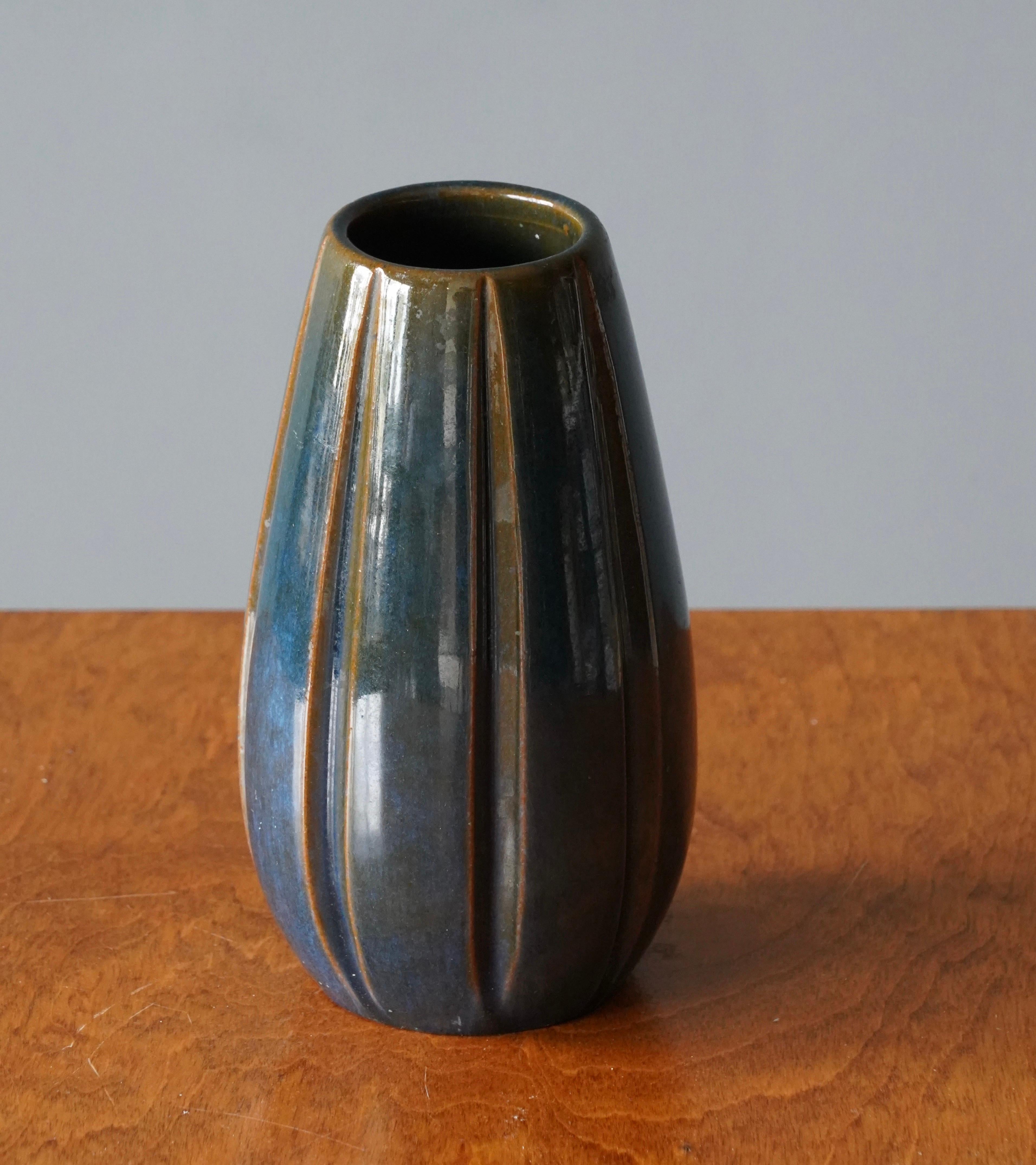 An early modernist vase. Designed by Vicke Lindstrand, for Upsala-Ekeby, Sweden, 1940s. Stamped.

Other designers of the period include Ettore Sottsass, Carl Harry Stålhane, Lisa Larsson, Axel Salto, and Arne Bang.