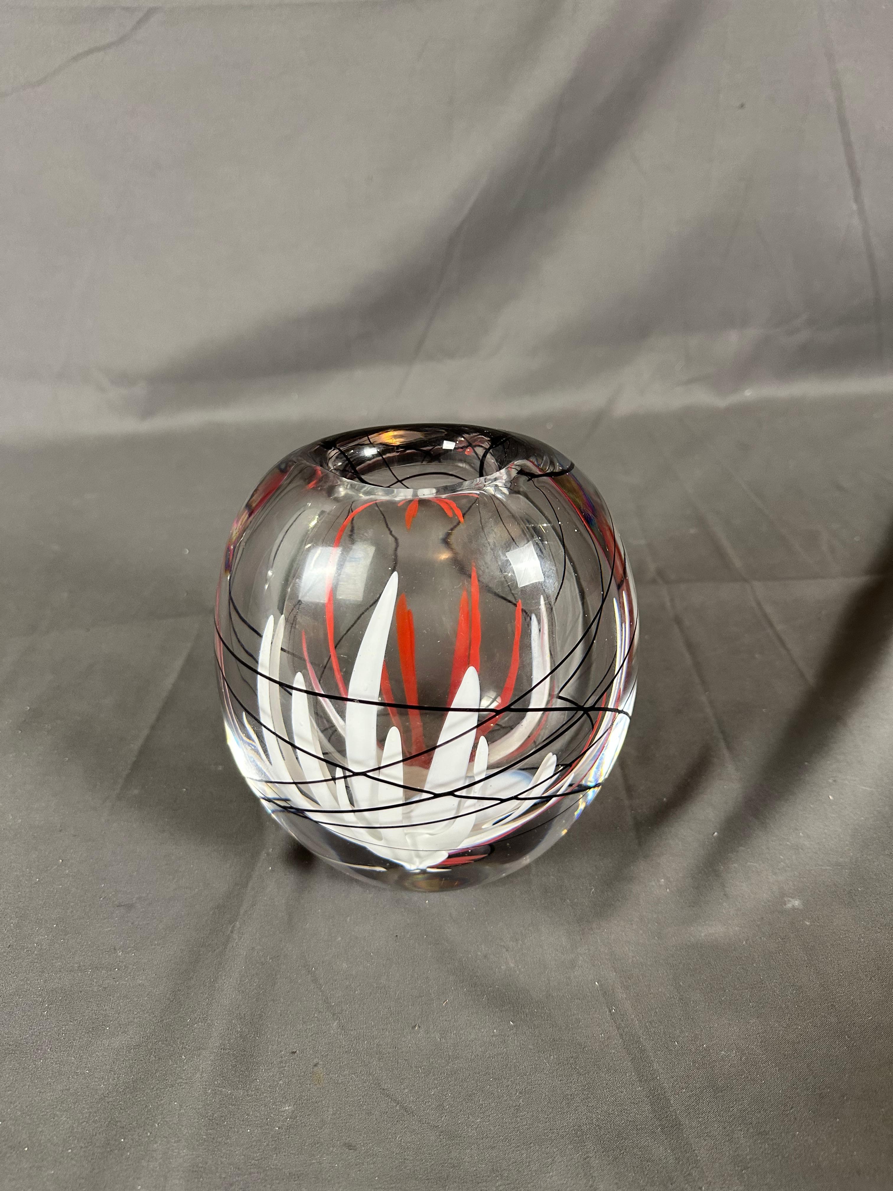 The vase has a few minor scratches from use at its bottom where it also has 