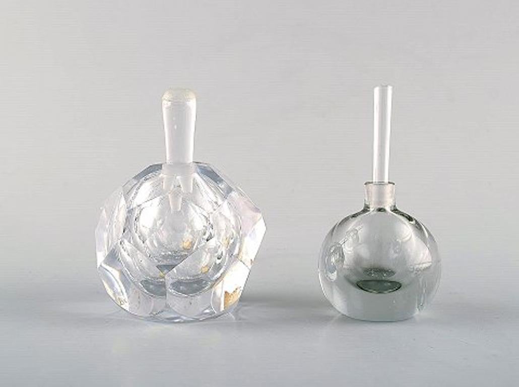 Vicke Lindstrand for Kosta Boda and Edward Hald for Orrefors. A collection of six mouth blown perfume bottles in clear art glass. Designed in the 1940s-1960s.
In very good condition.
Incised signature
Largest measures: 7 x 6.5 cm.