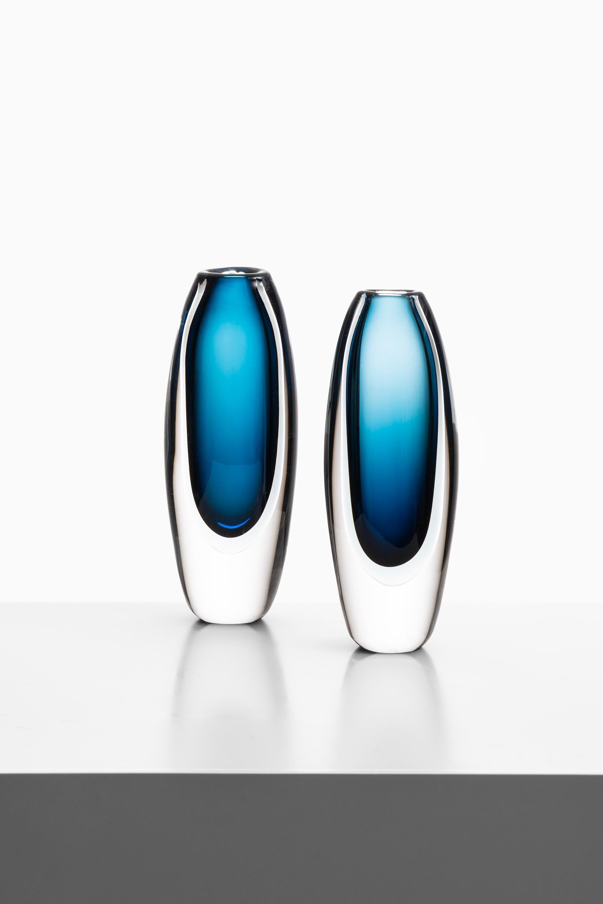Pair of glass vases designed by Vicke Lindstrand. Produced by Kosta in Sweden. Signed ‘Kosta 01828 VL'.