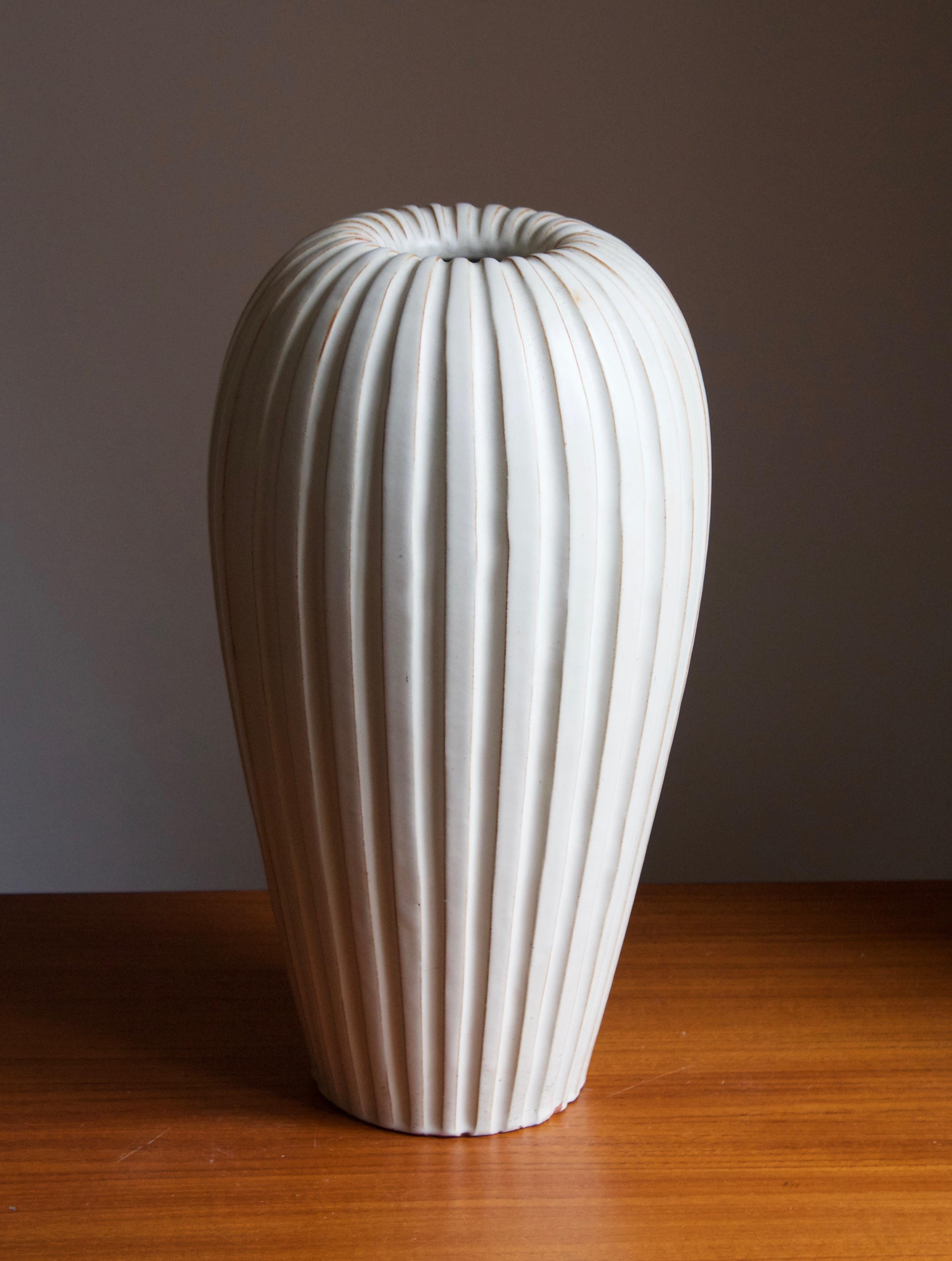 An early modernist vase. Designed by Vicke Lindstrand, for Upsala-Ekeby, Sweden, 1940s. 

Other designers of the period include Ettore Sottsass, Carl Harry Stålhane, Lisa Larsson, Axel Salto, and Arne Bang.