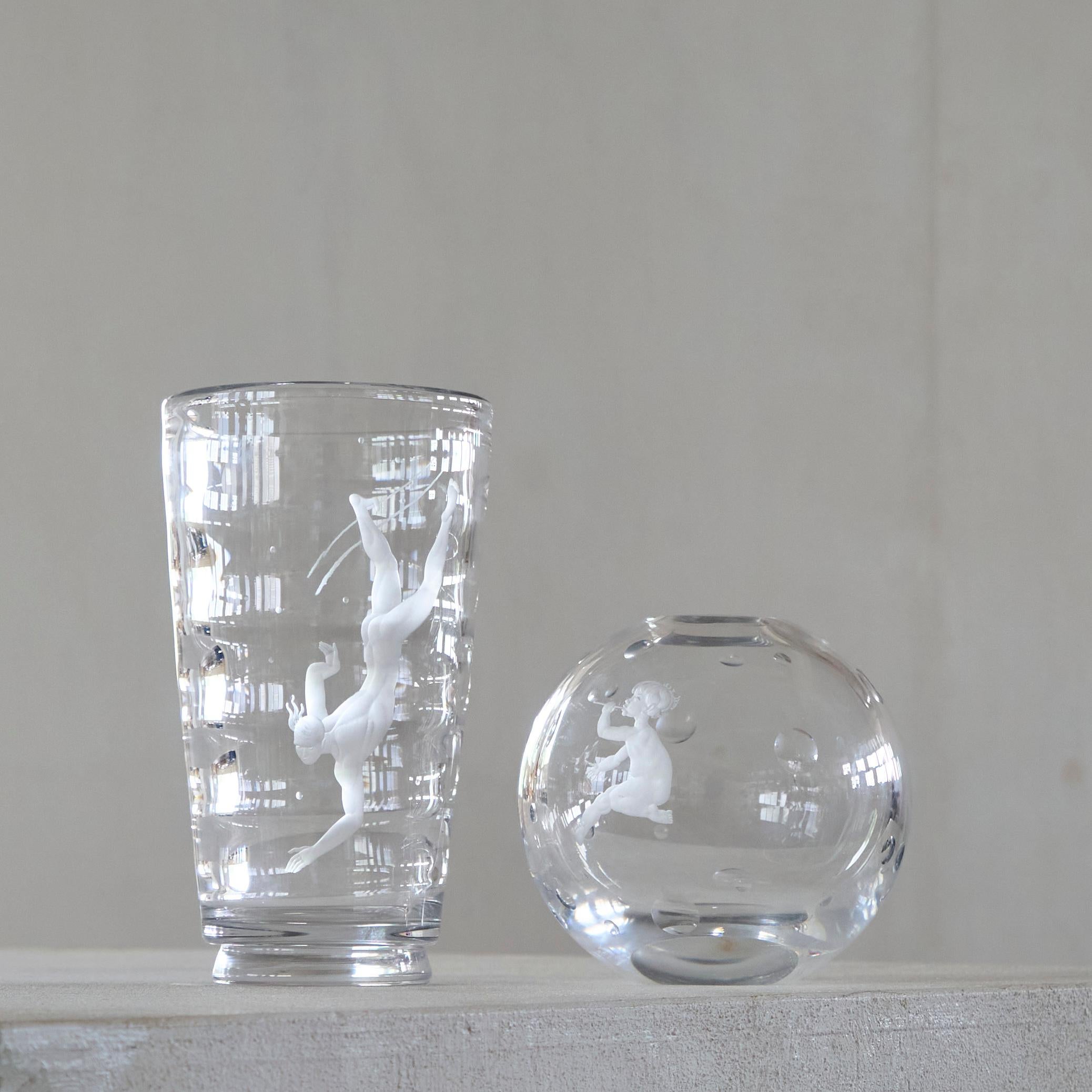 Vicke Lindstrand Rare Pair of Art Deco Vases in Etched Glass for Orrefors, Sweden, 1930s.

1: A very rare and mesmerizingly beautiful 'diver' vase by Vicke Lindstrand for Orrefors - designed in 1934. A wonderful design with a stylized diver in a