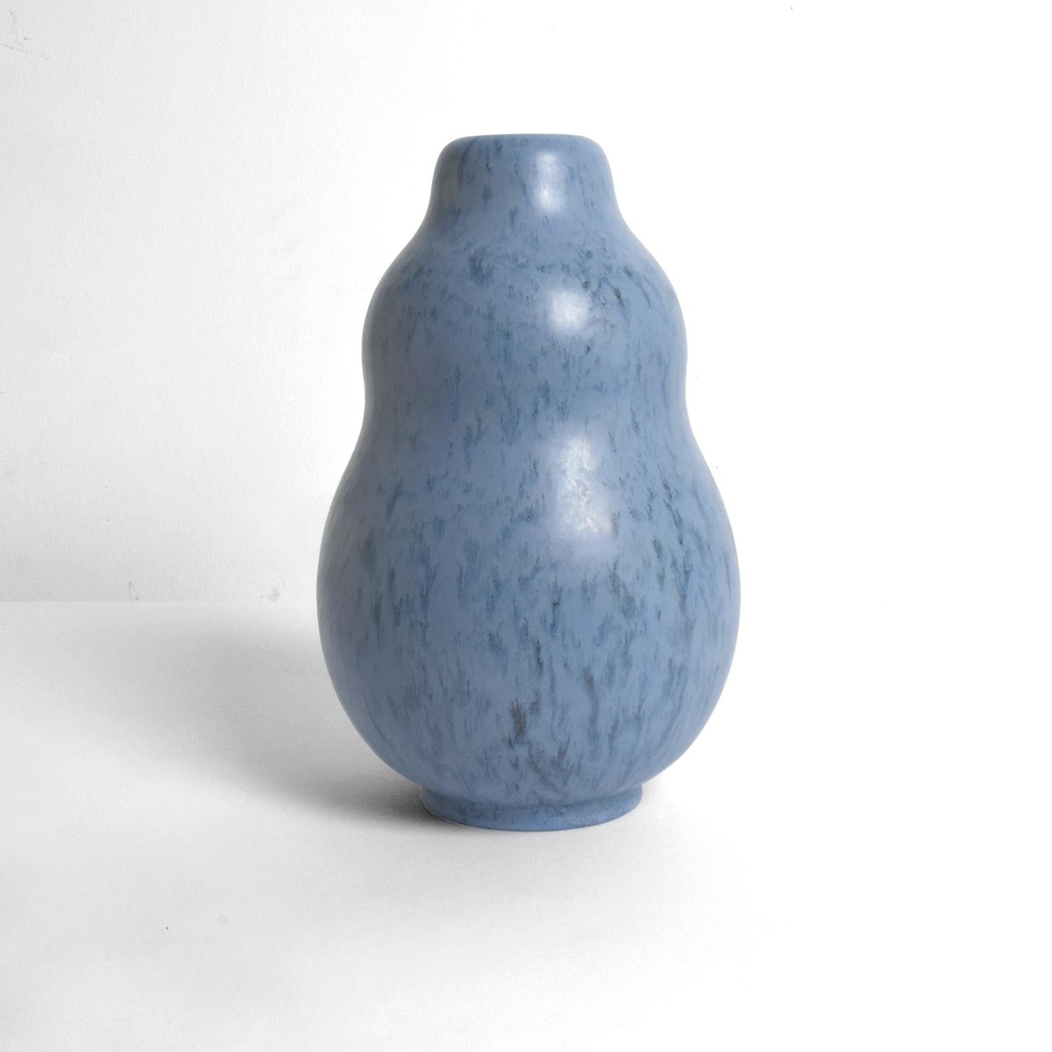 Scandinavian Modern ceramic vase designed by Vicke Lindstrand for Upsala Ekeby, Sweden, circa 1940’s. The vase’s soft organic form is highlighted by a beautiful mottled glaze. 

Measures: height 10” diameter: 7”.