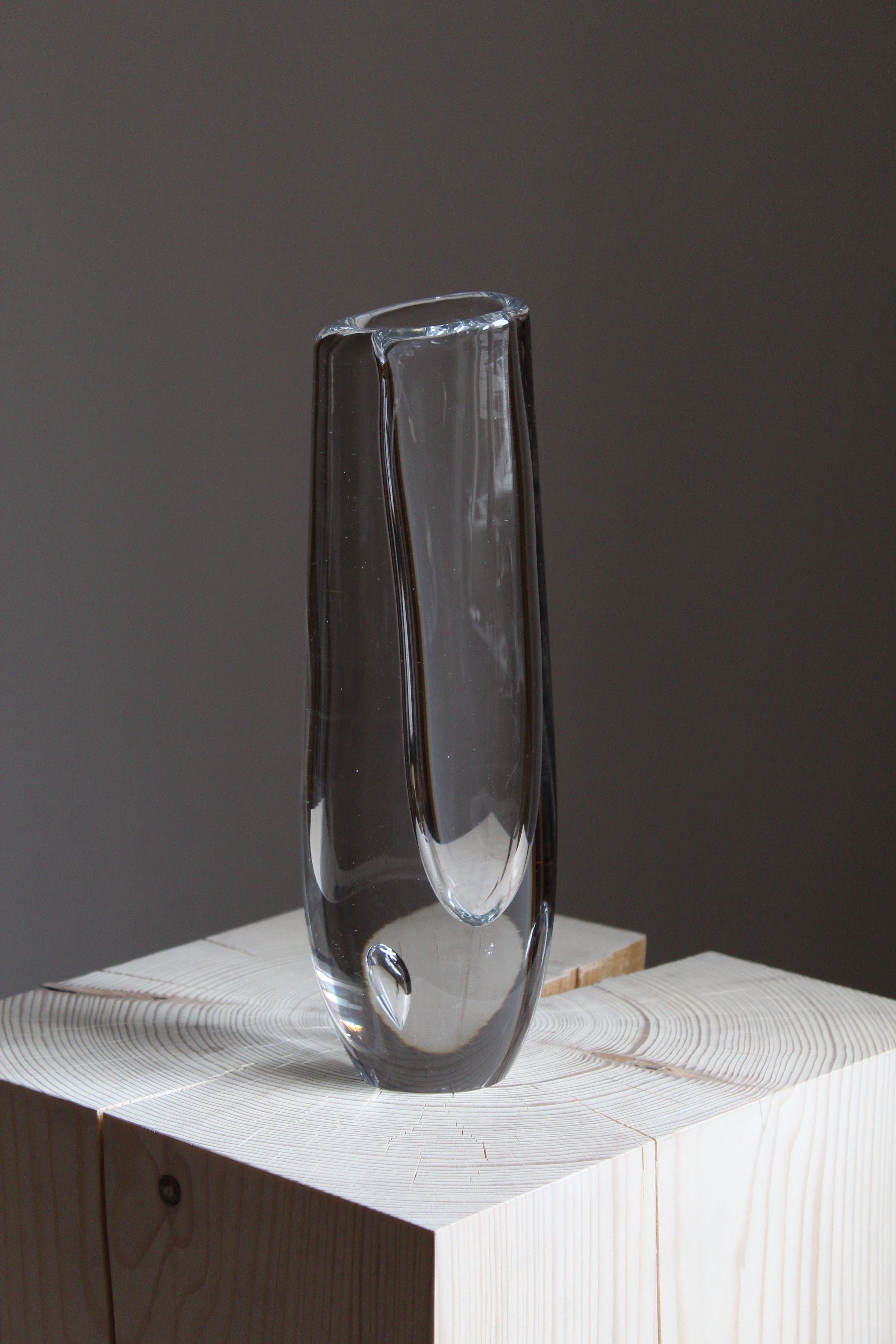 An organic blown glass vase. Designed by Vicke Lindstrand, produced by Kosta, Sweden, circa 1940s. Signed.

 