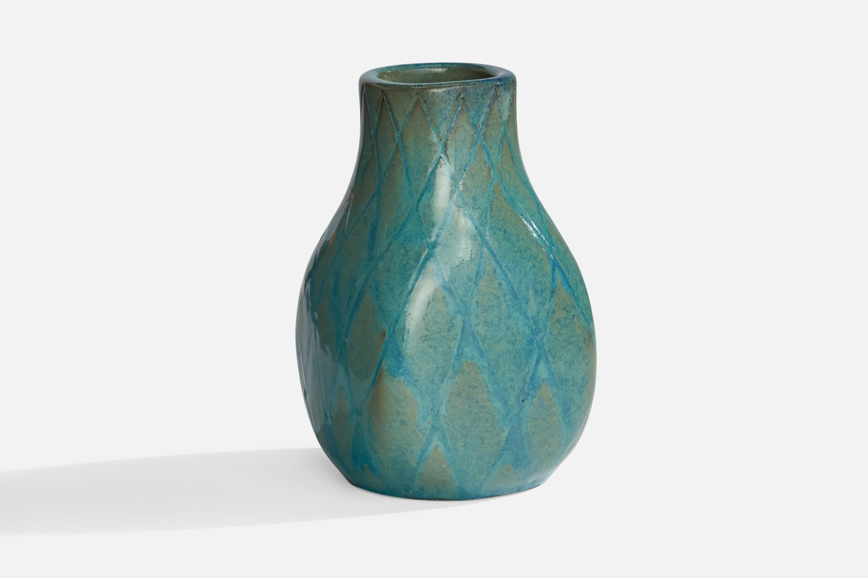 A blue-glazed earthenware vase designed by Vicke Lindstrand designed by Upsala Ekeby, Sweden, 1930s.
