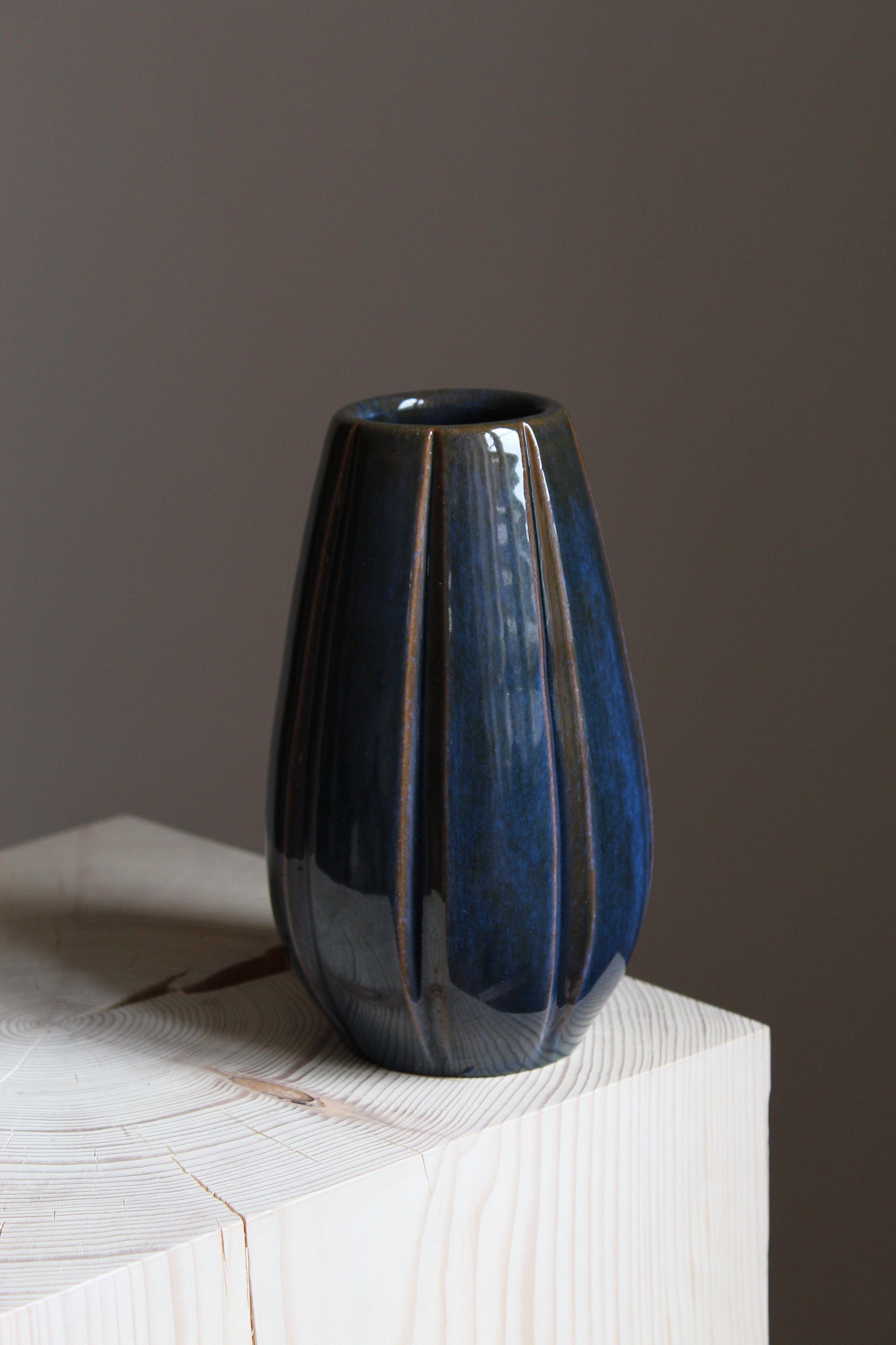 An early modernist vase. Designed by Vicke Lindstrand, for Upsala-Ekeby, Sweden, 1940s. Stamped and signed with artists initials.

Other designers of the period include Ettore Sottsass, Carl Harry Stålhane, Lisa Larsson, Axel Salto, and Arne Bang.