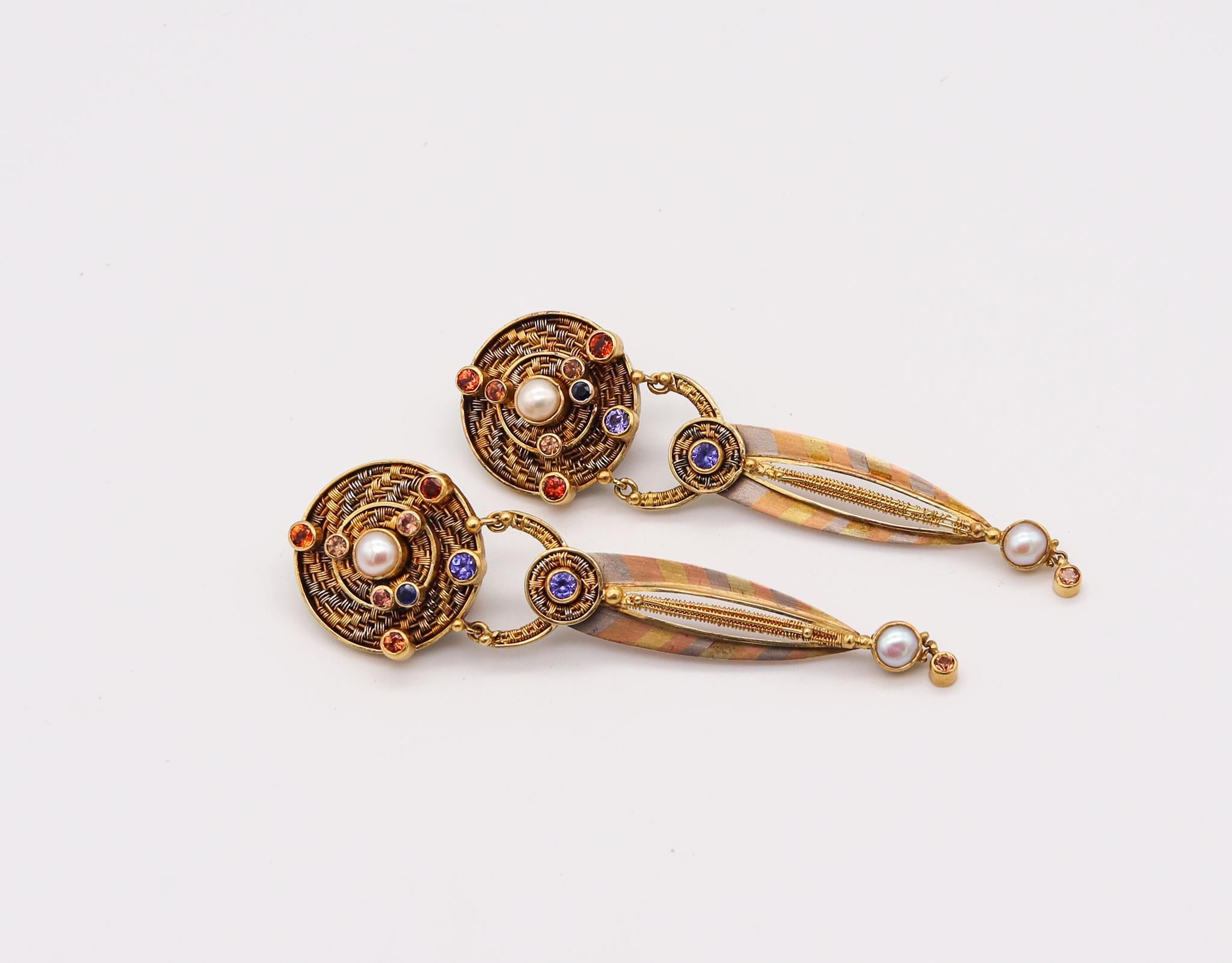 Drop earrings designed by Vicki Eisenfeld.

Fabulous one of a kind pair of drop earrings, created in Connecticut by the talented studio jewelry designer Vicky Elsenfeld. This beautiful earrings has been carefully crafted with intricate weaving