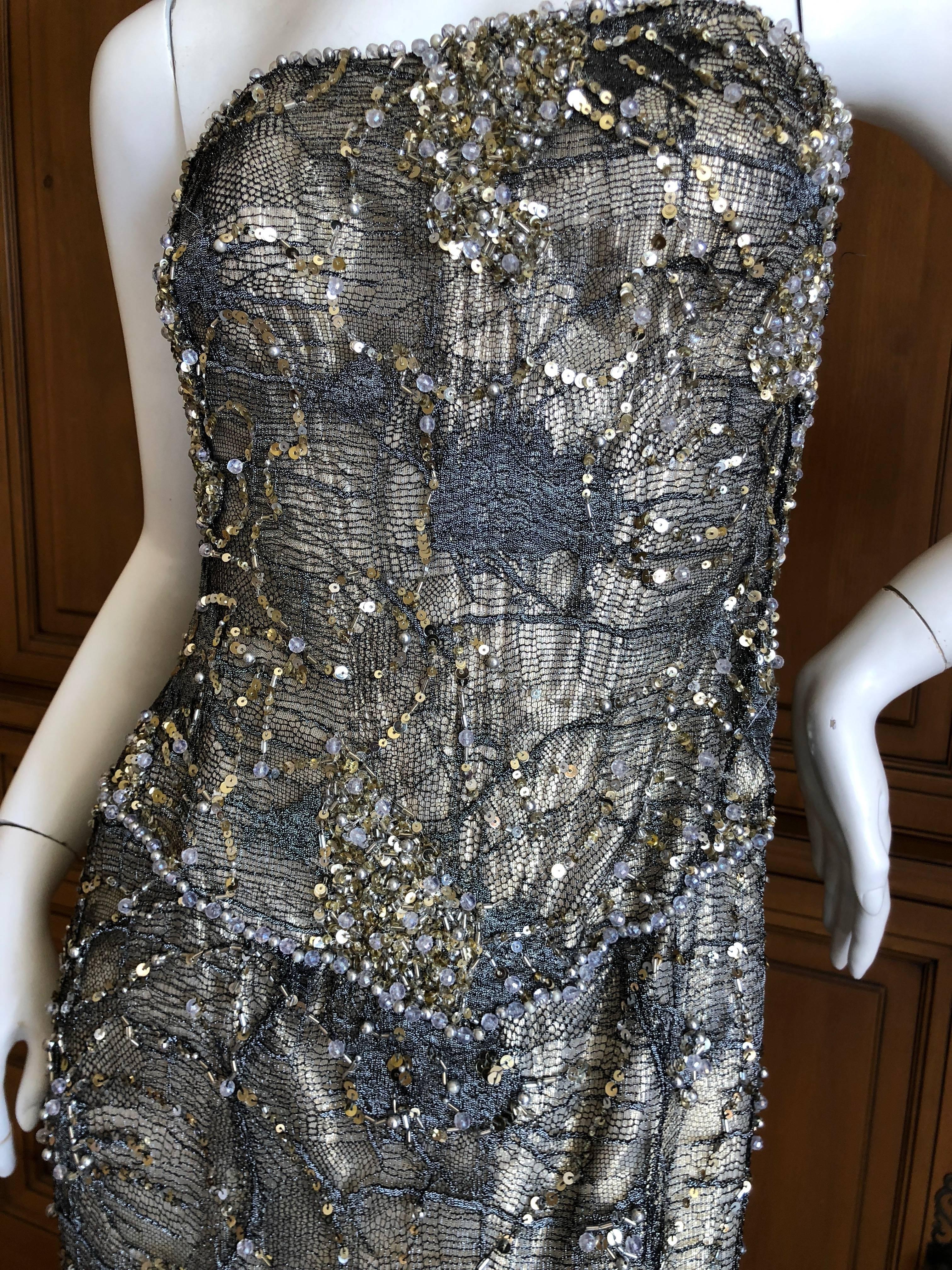 Vicky Teil Couture Paris Bergdorf Goodman Gold Corseted Strapless Beaded Dress.
The under dress is gold, with a full corset, over dress is exquisitely embellished with sequins and beads.
This has a built in inner corset  and zips up the back.
Please