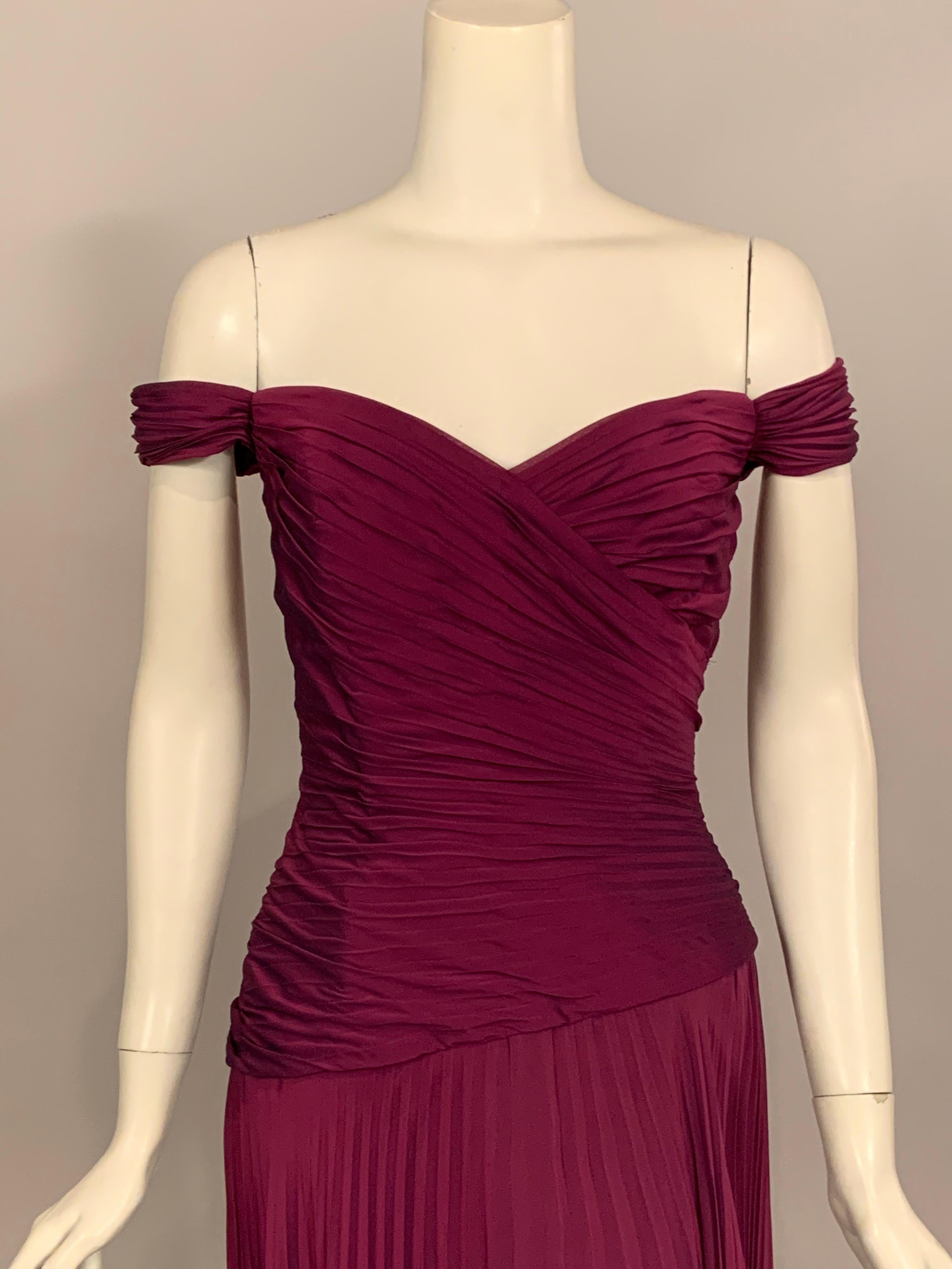 American designer Vicky Tiel, working in Paris designed beautiful evening dresses. This sexy long evening dress is a perfect example of her style. Changeable silk chiffon starts out violet and takes on a deep purple tint when you move. The bodice is