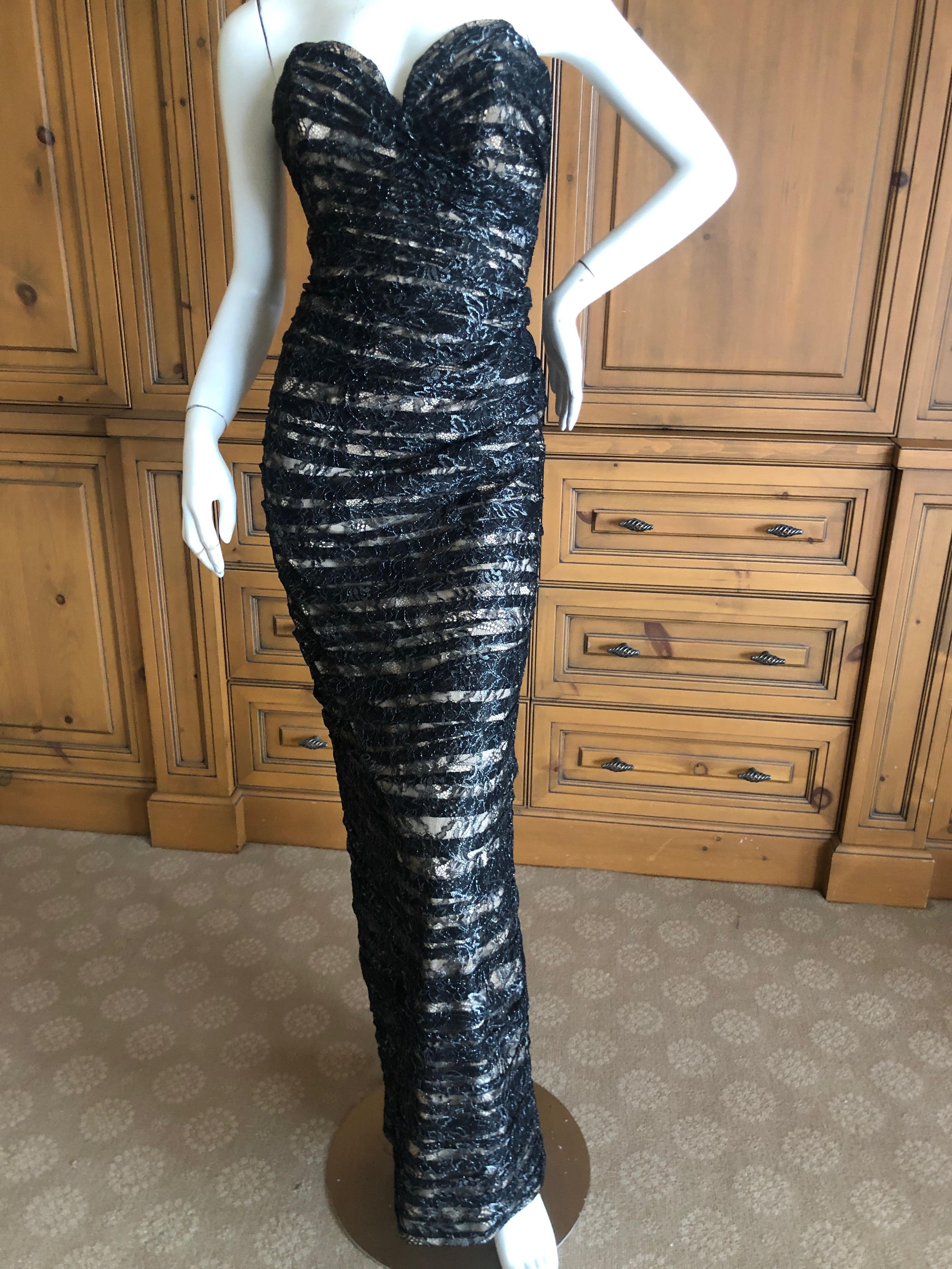 Vicky Tiel Paris Vintage Silver Accented Black Lace Strapless Siren Dress with Inner Corset.
Size 6
Bust 36