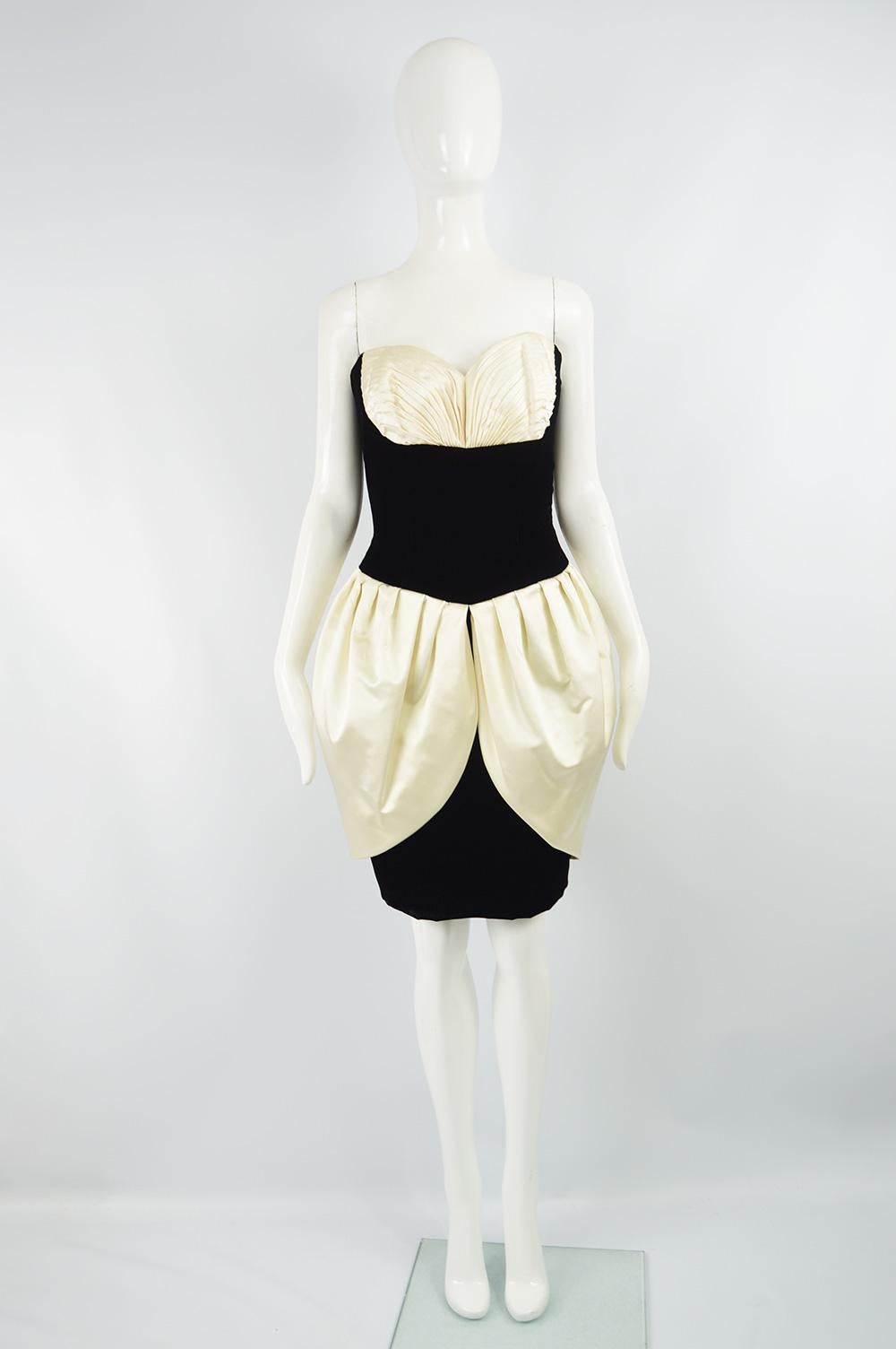 A beautiful vintage strapless party dress from the 80s by Vicky Tiel. In a sumptuous black velvet with an ivory pleated silk shelf bust and tulip skirt. 

Size: Marked vintage 44 but fits more like a UK 12/ US 8/ EU 40. Please check measurements.