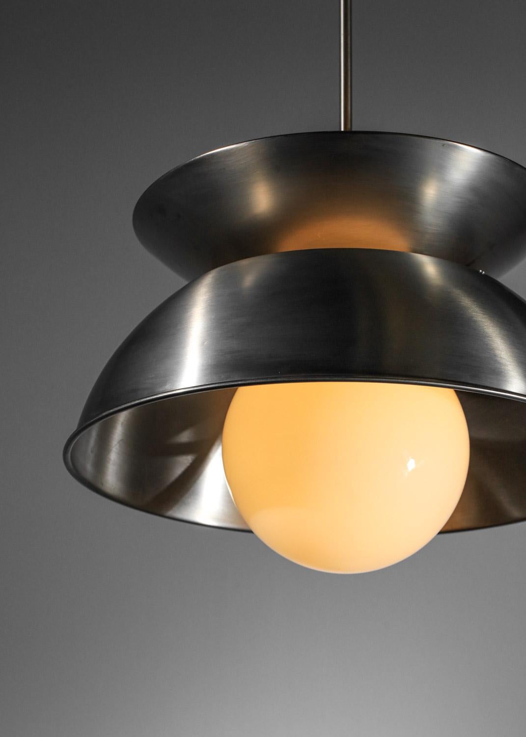 Artemide in the 1970s. This pendant light is made up of two brushed metal lampshades with double lighting (inside each of the lampshades). Very beautiful vintage condition, note scratches and traces of oxidation on the luster. We recommend four E27